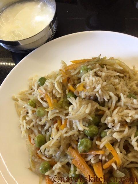 Coriander stalks pulao served in a plate with curd