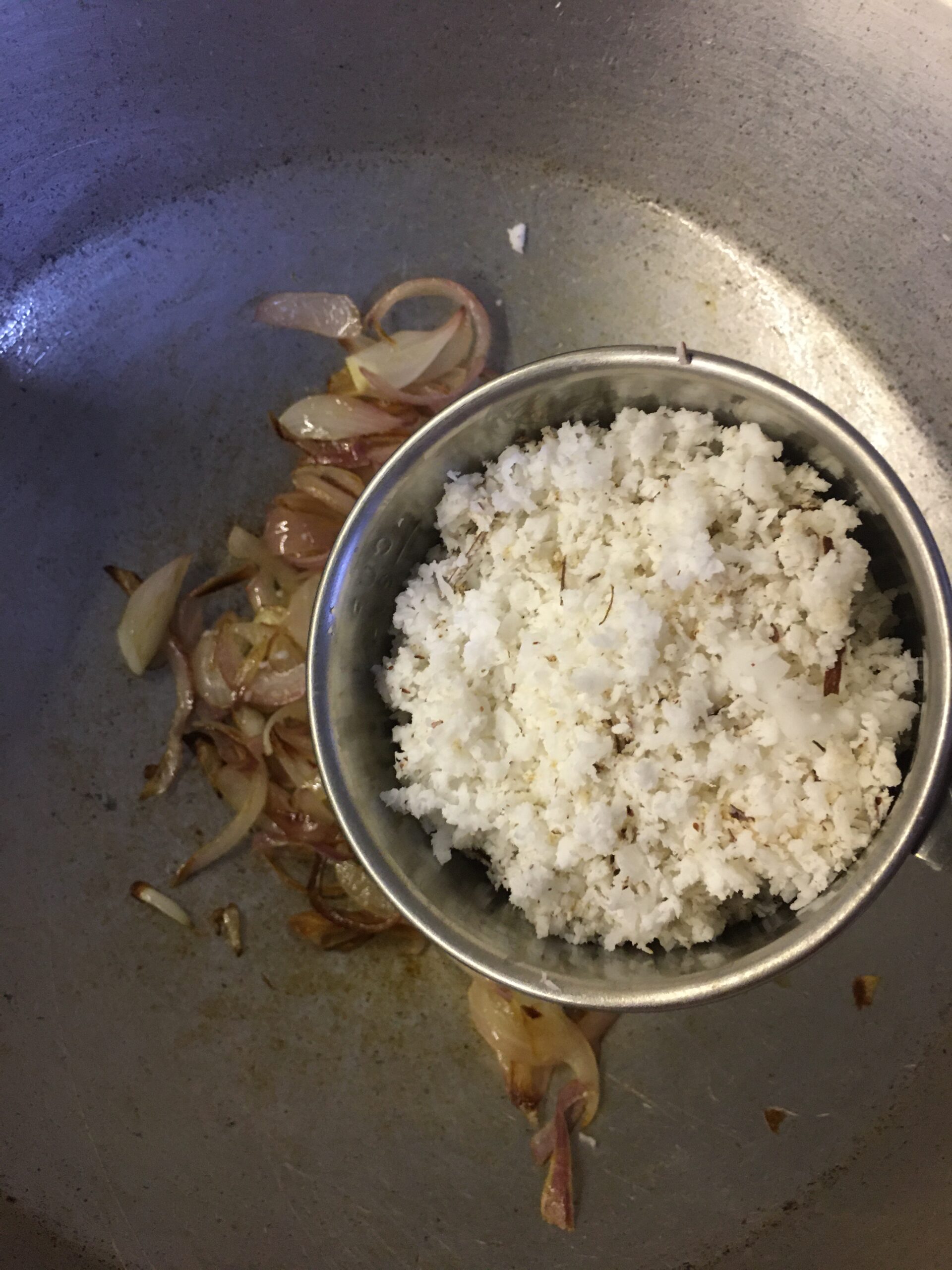 Adding grated coconut