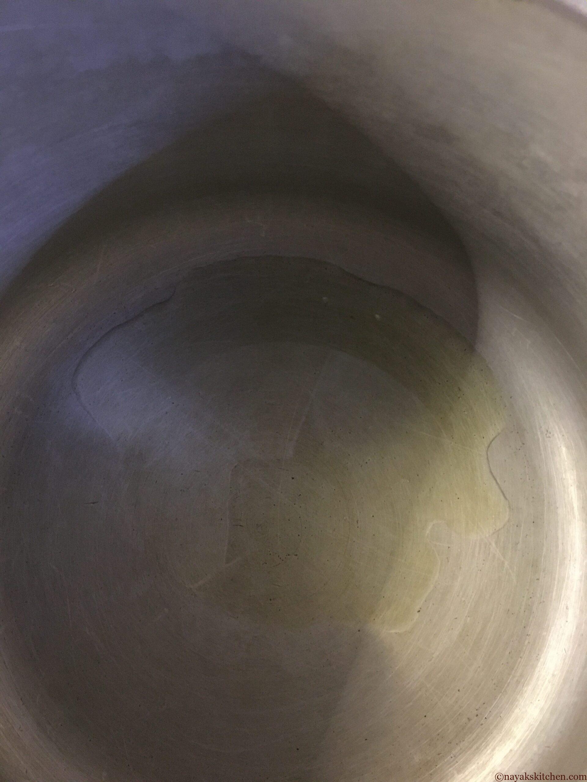 Heating oil in a pressure cooker