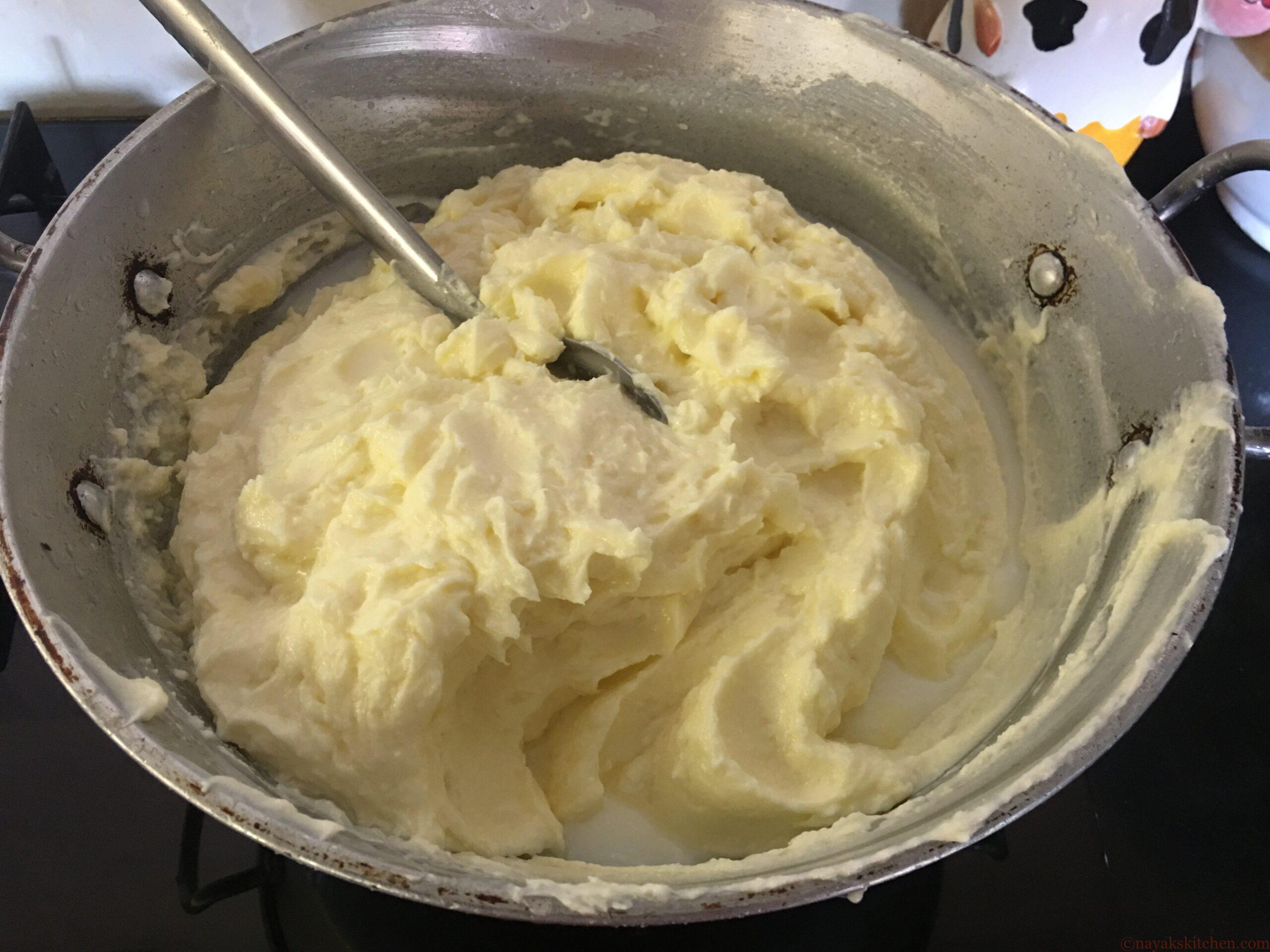Placing vessel with collected butter on gas