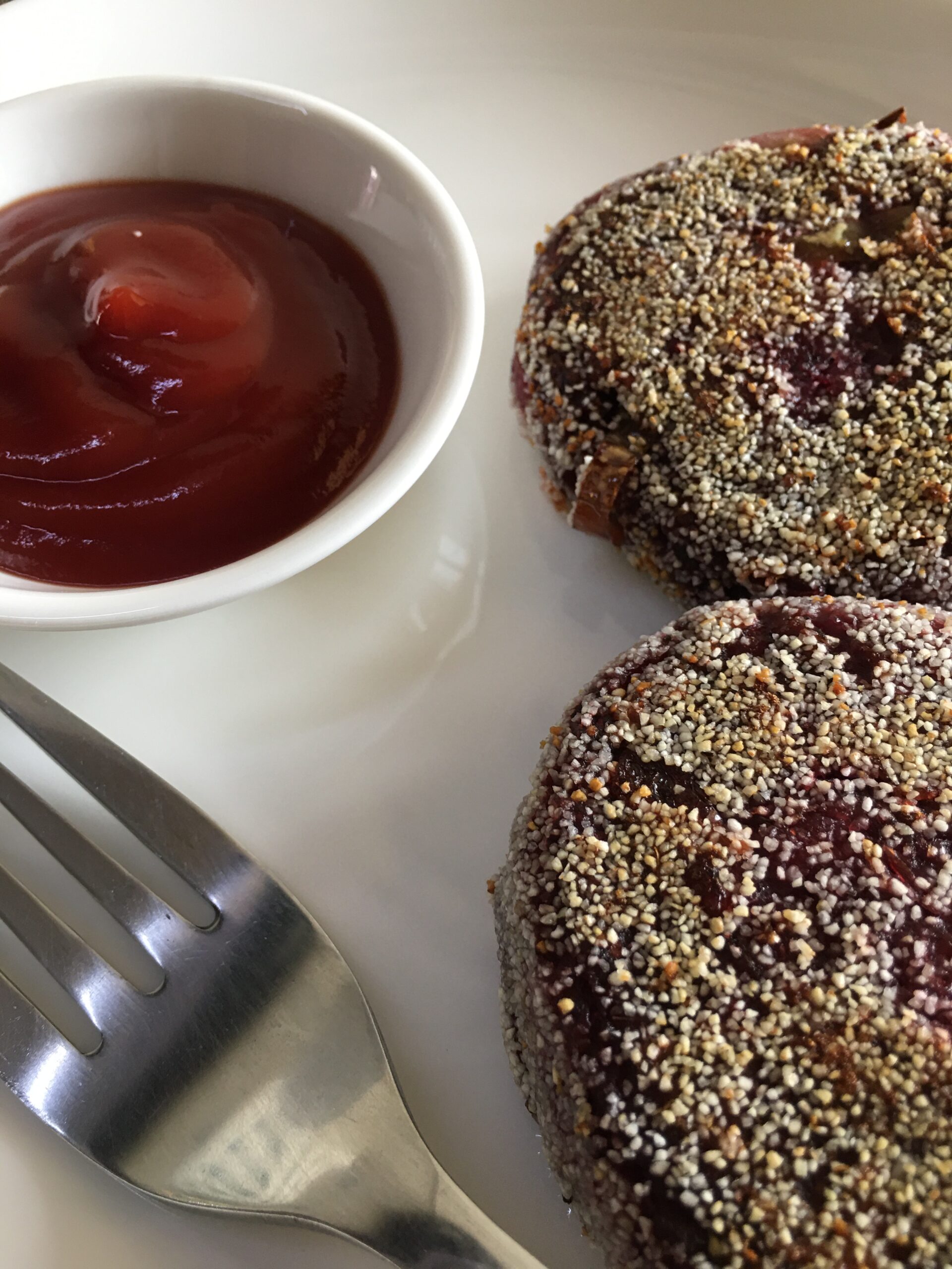 Beetroot cutlets served in a plate with sauce