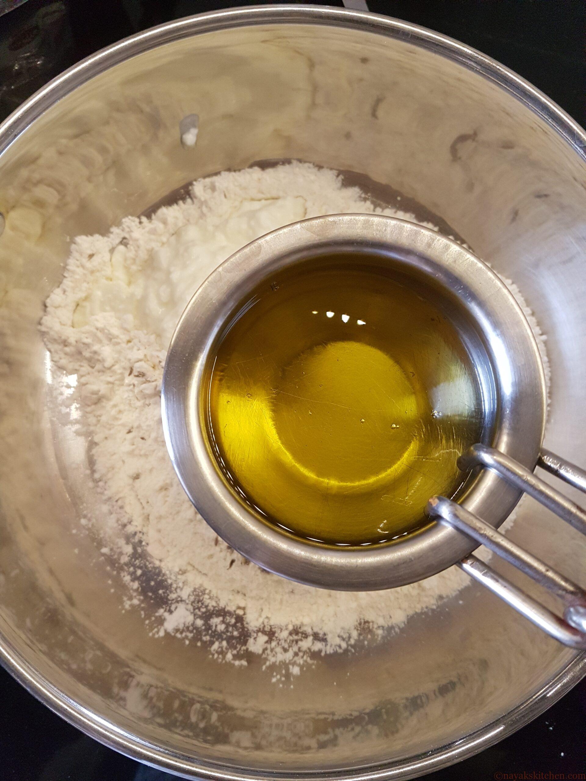 Adding ghee to mixture
