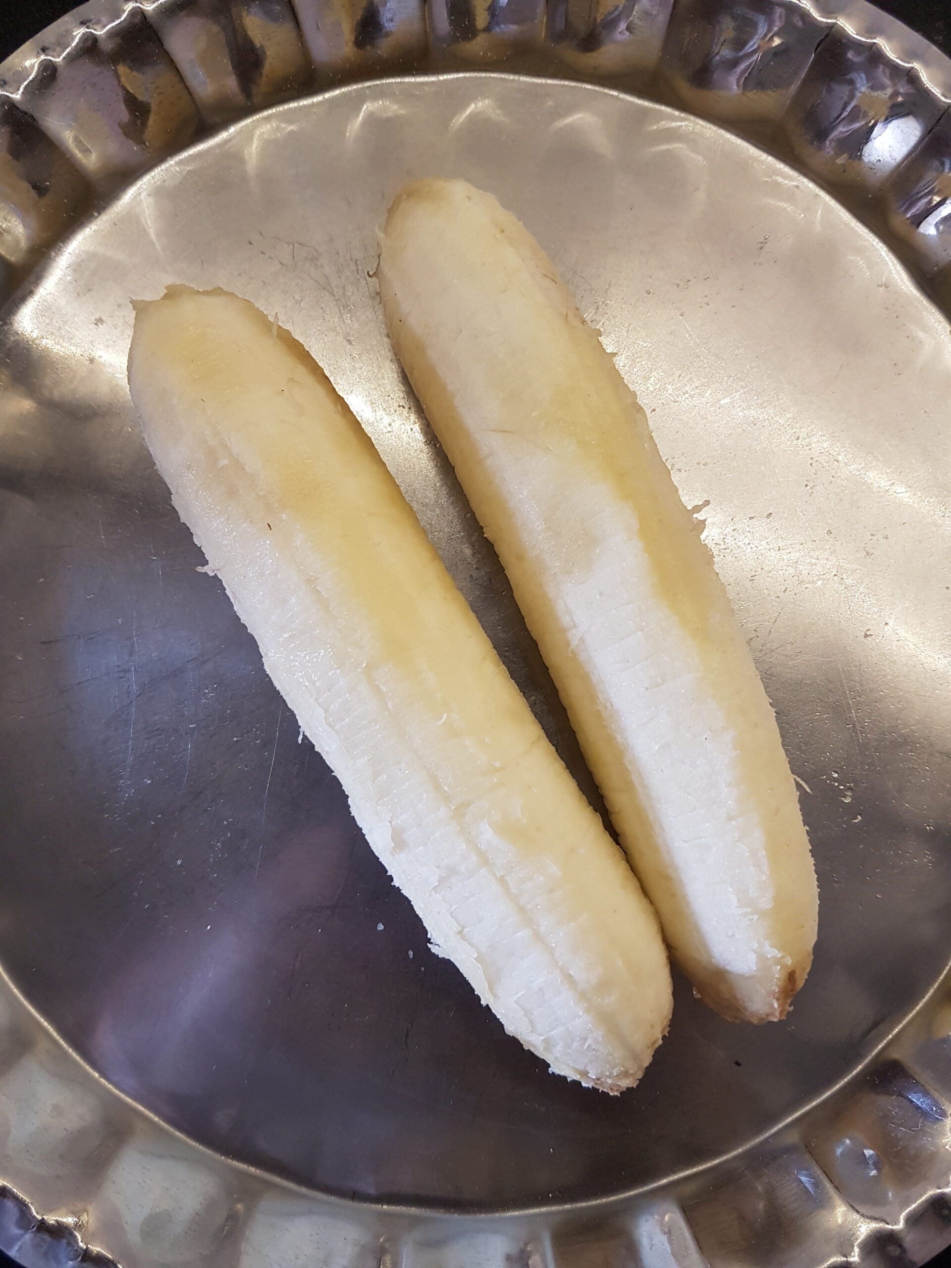 Peeling the bananas for goan banana buns