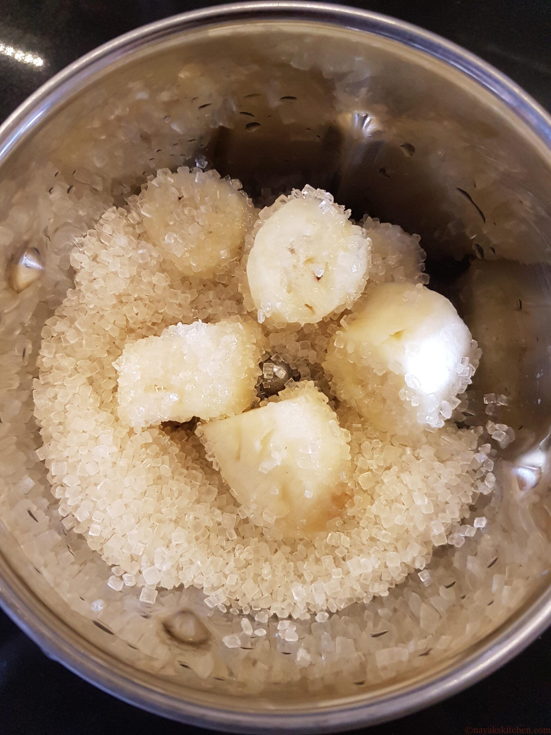 Chopped bananas and sugar added in a mixie