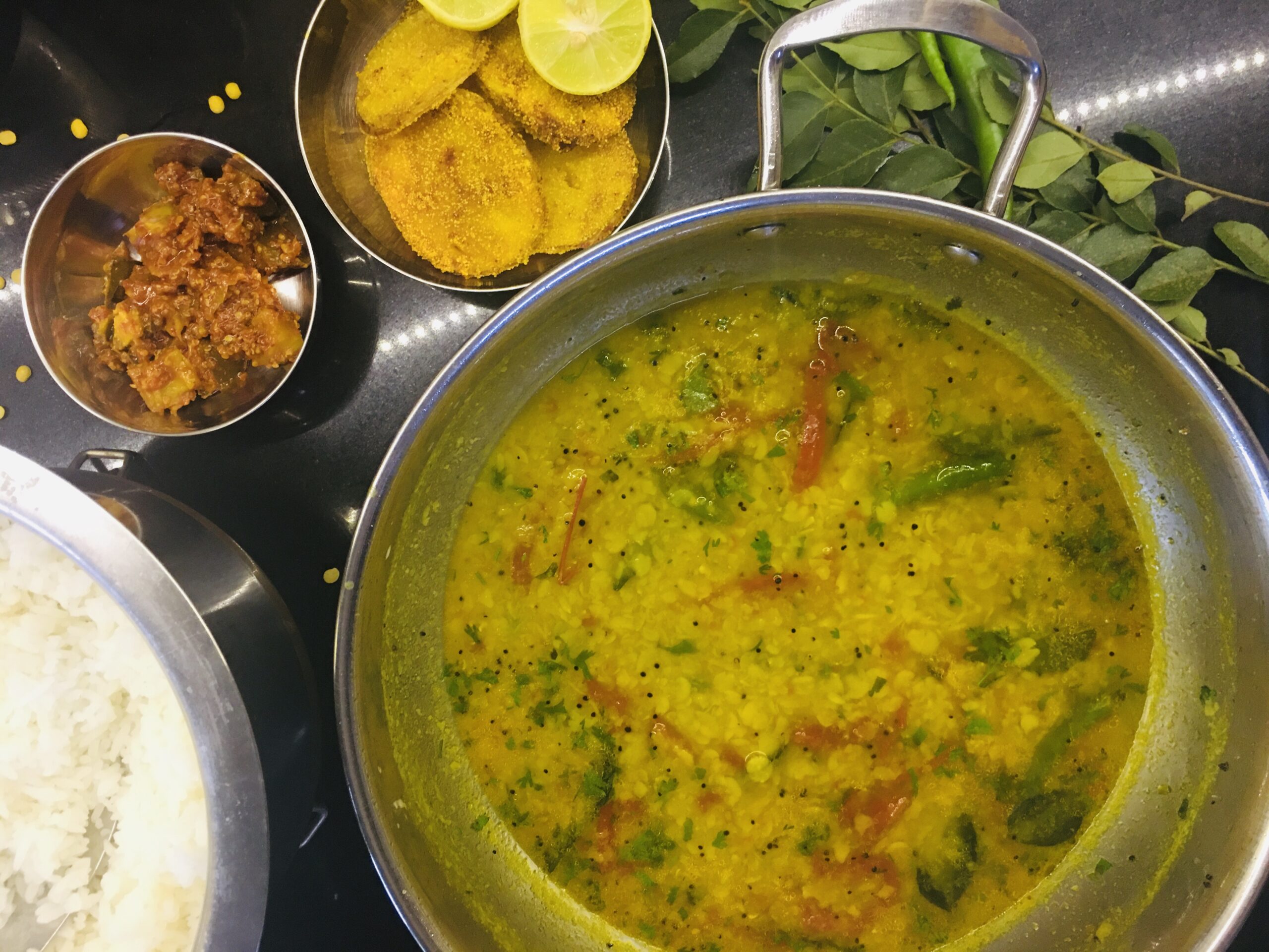 Dal, rice, pickle and batat fodi