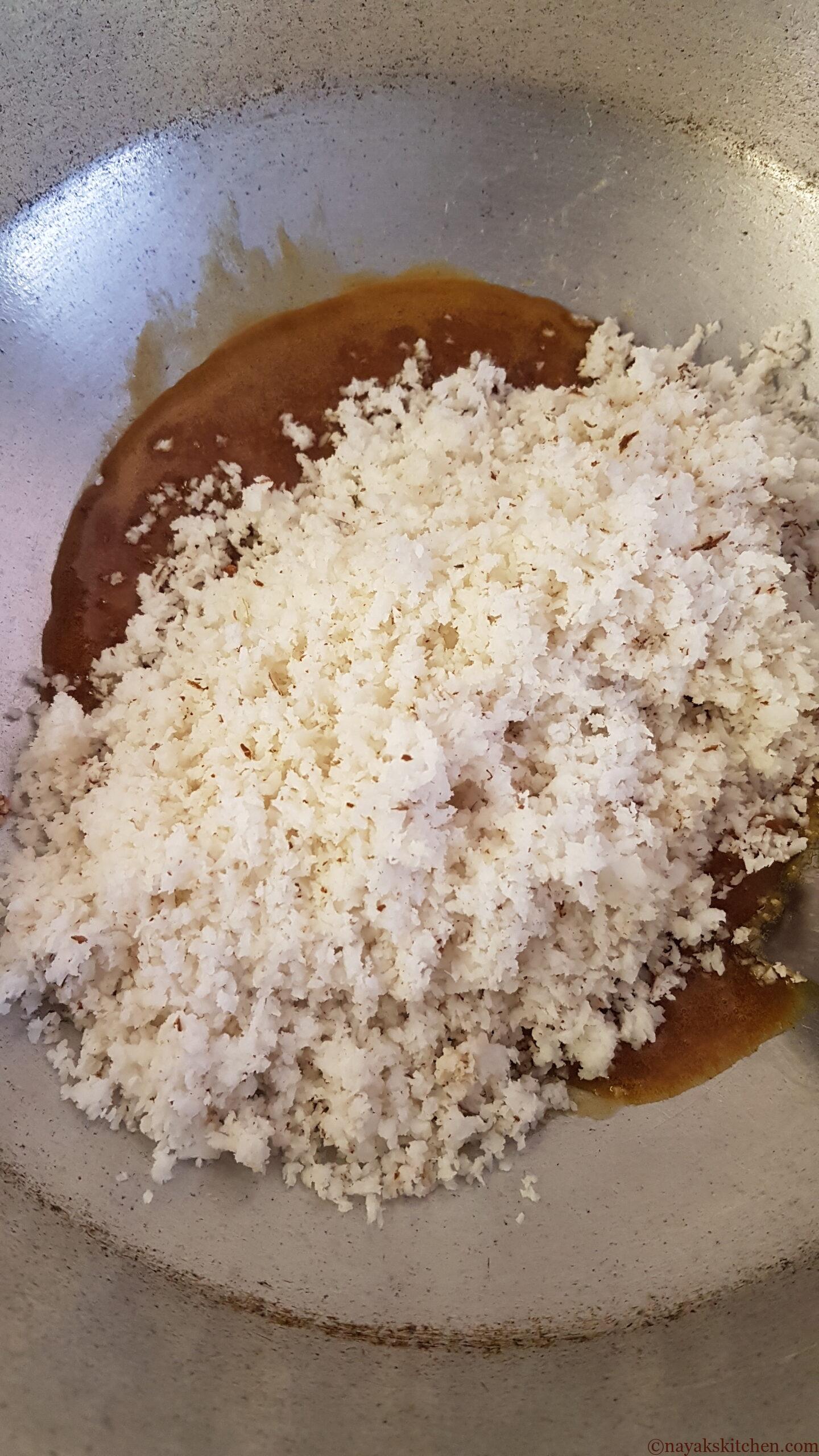 Adding coconut to melted jaggery