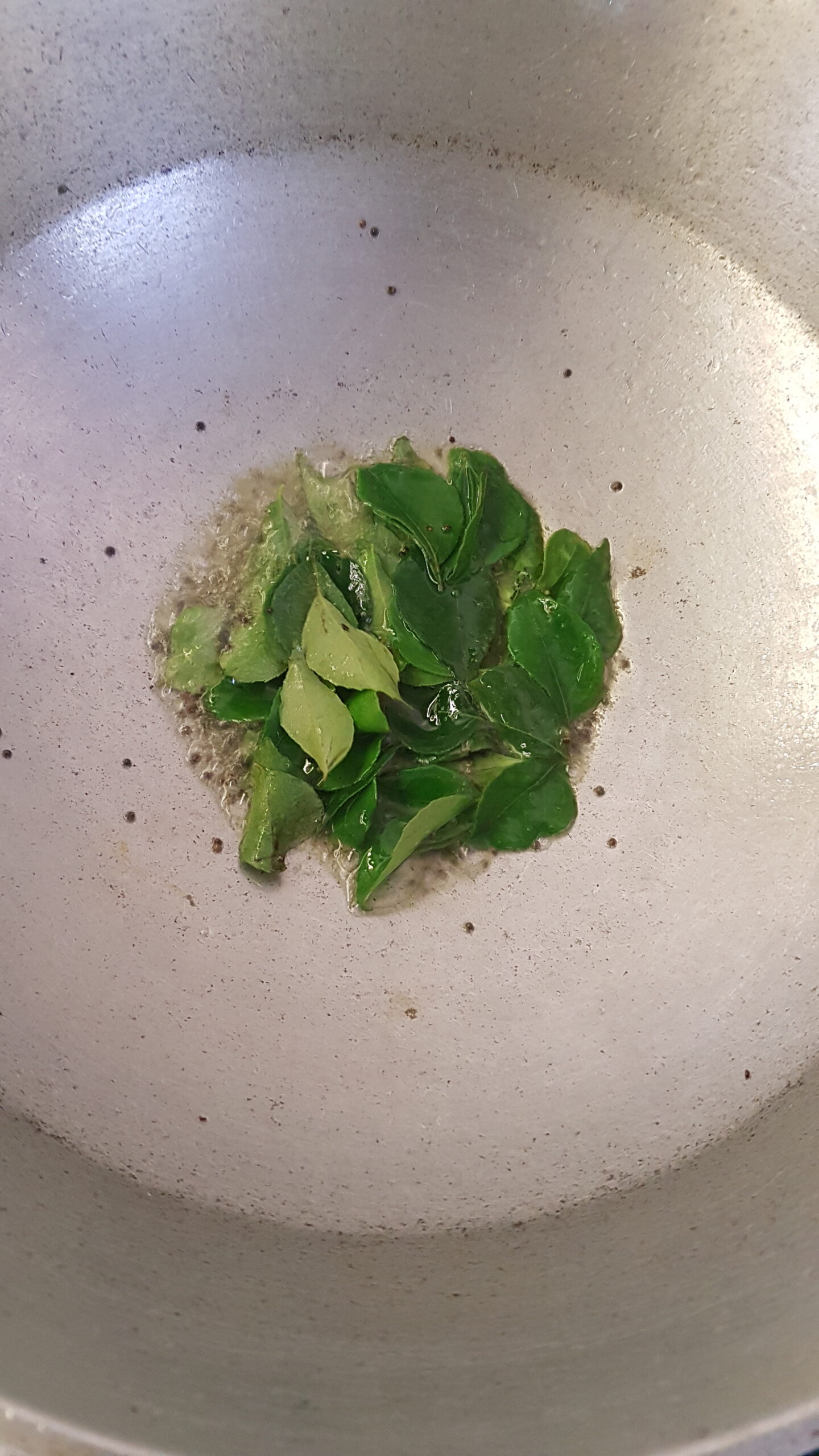 Adding curry leaves