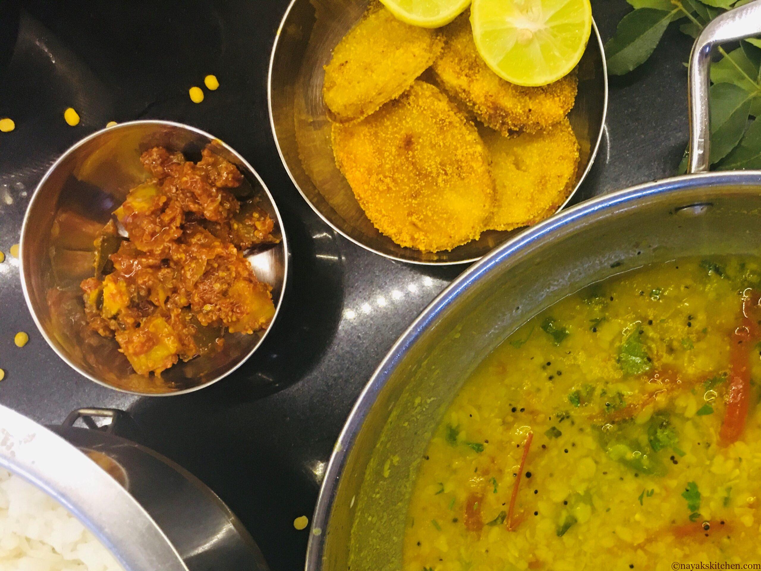 Batat fodi served with dal-rice and pickle