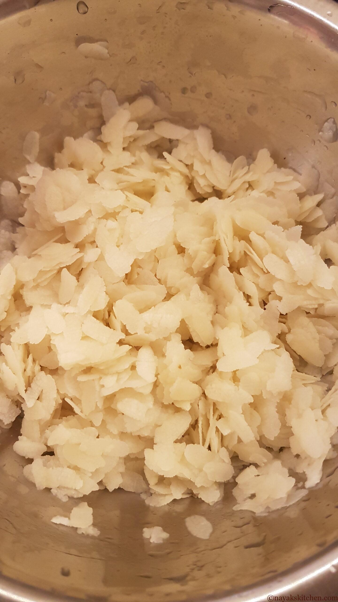Washing the beaten rice with water