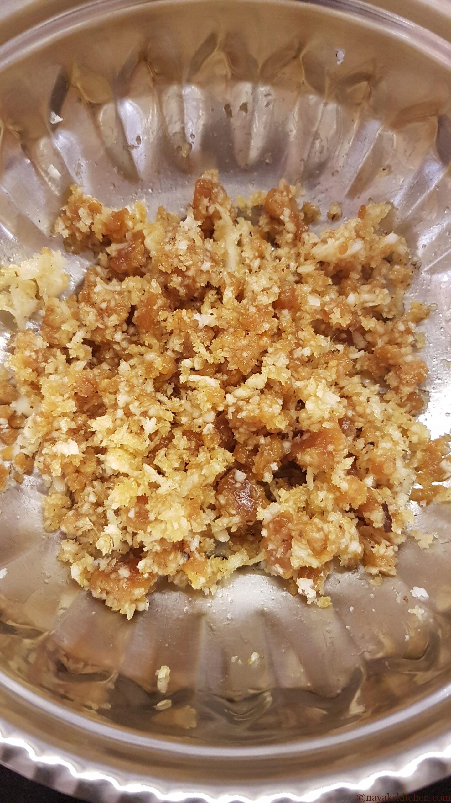 Mixing coconut and jaggery
