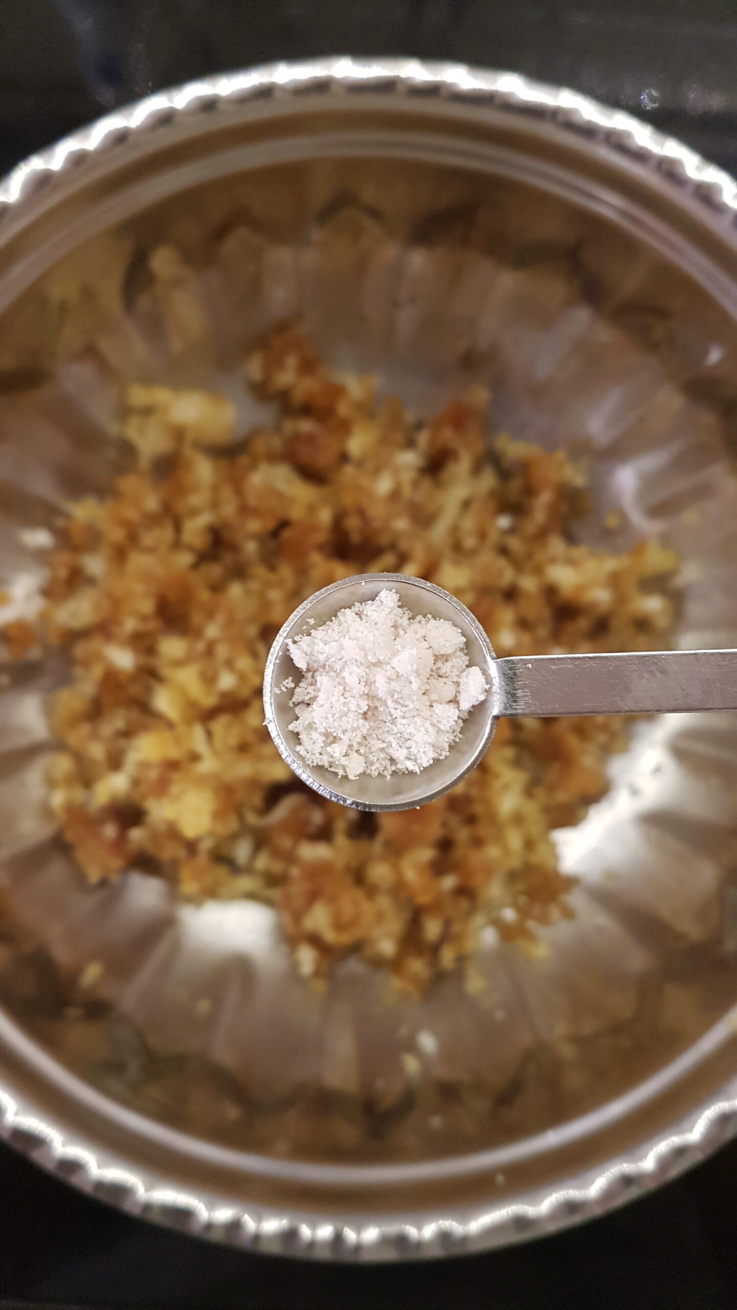 Adding salt to poha