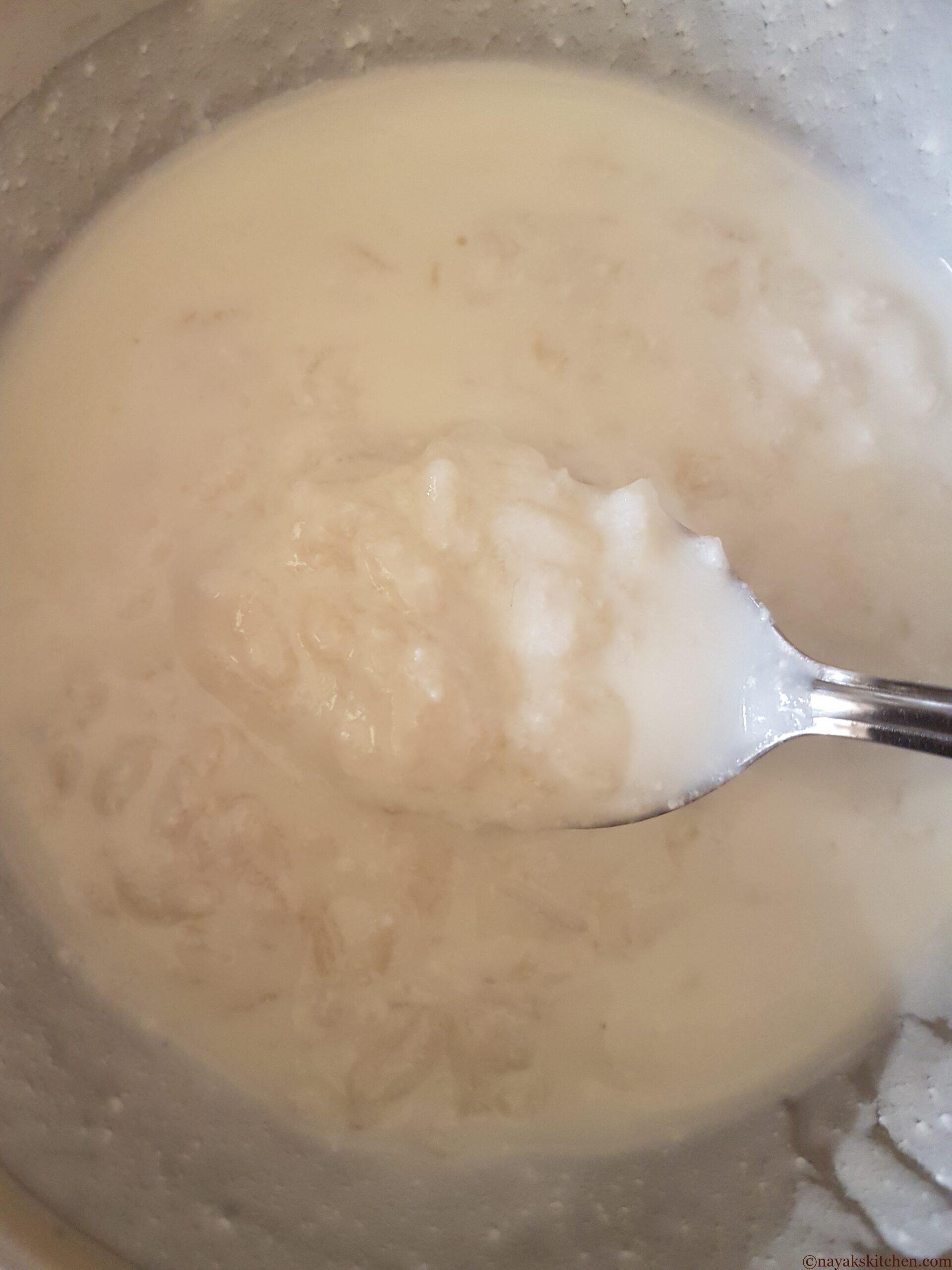 Mixing beaten rice and curd