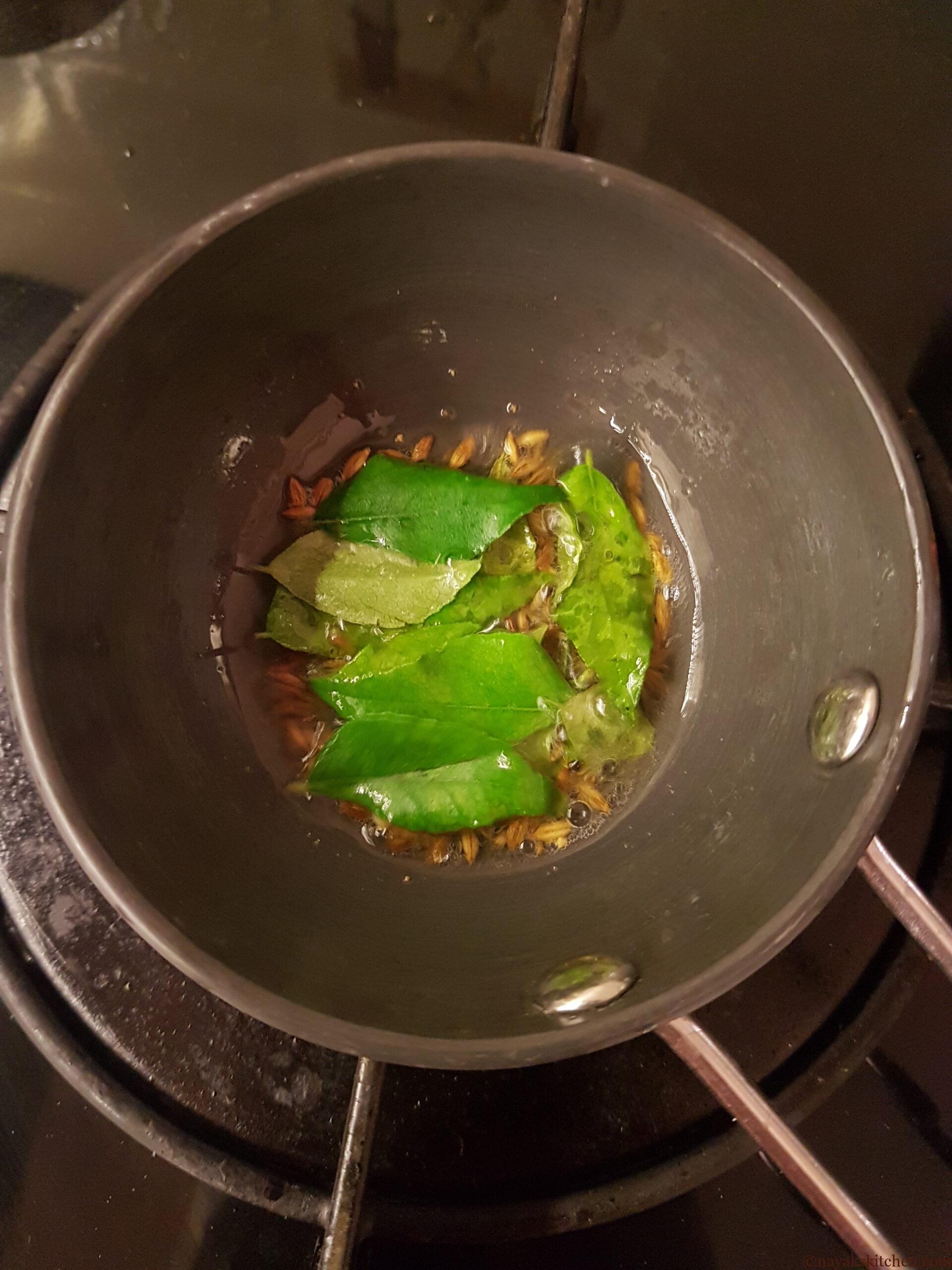 Adding curry leaves