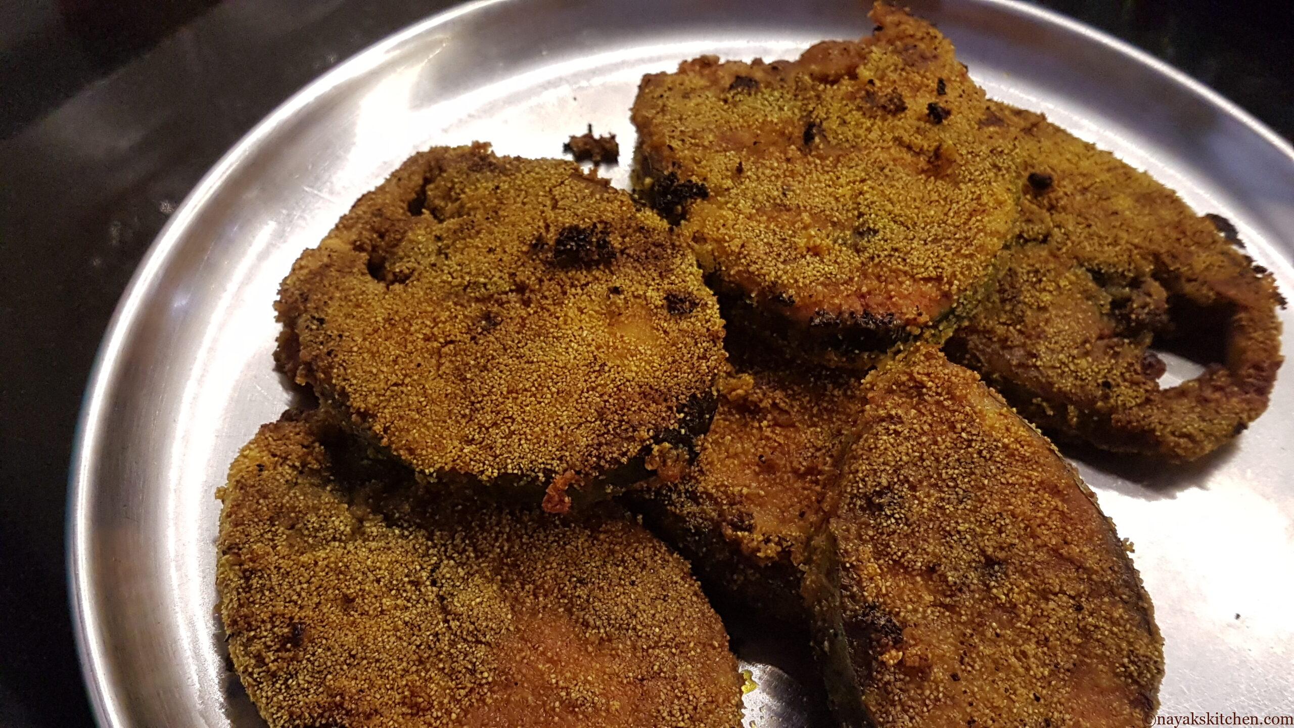 Fried kingfish served in a plate.