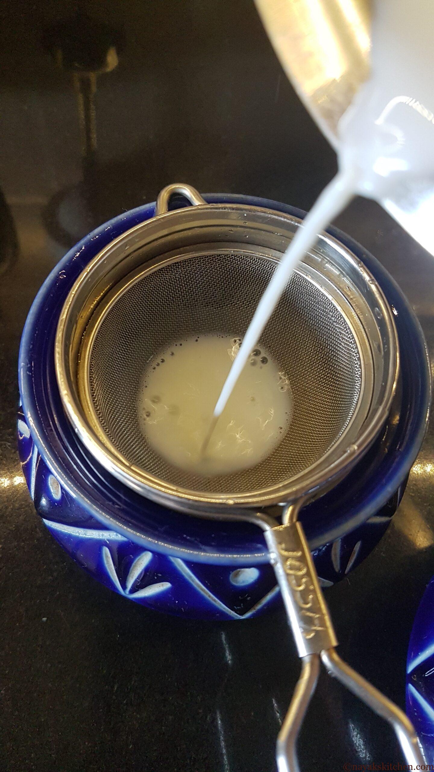 Straining milk to remove cream