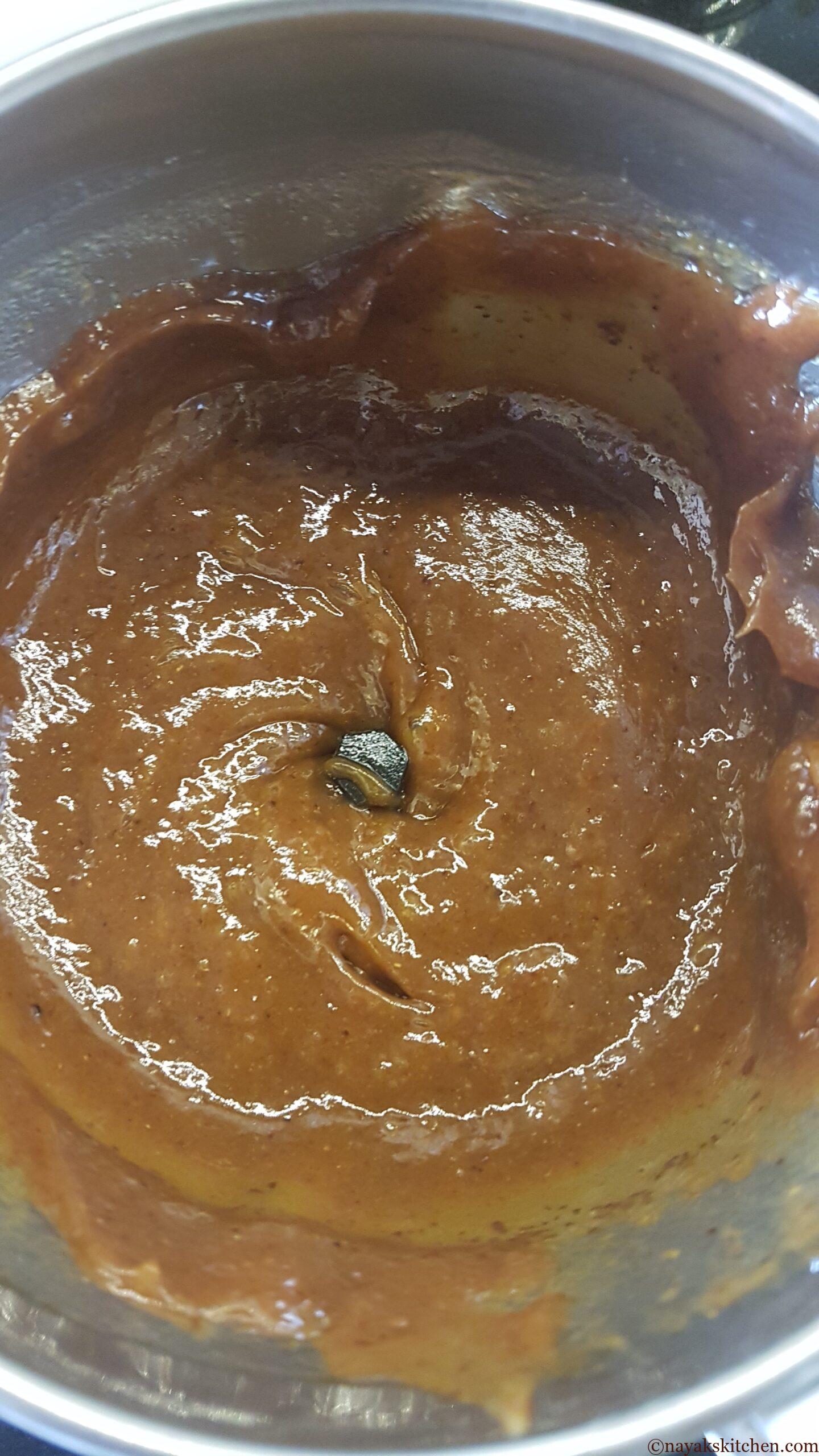 Grinding the mixture to a fine paste