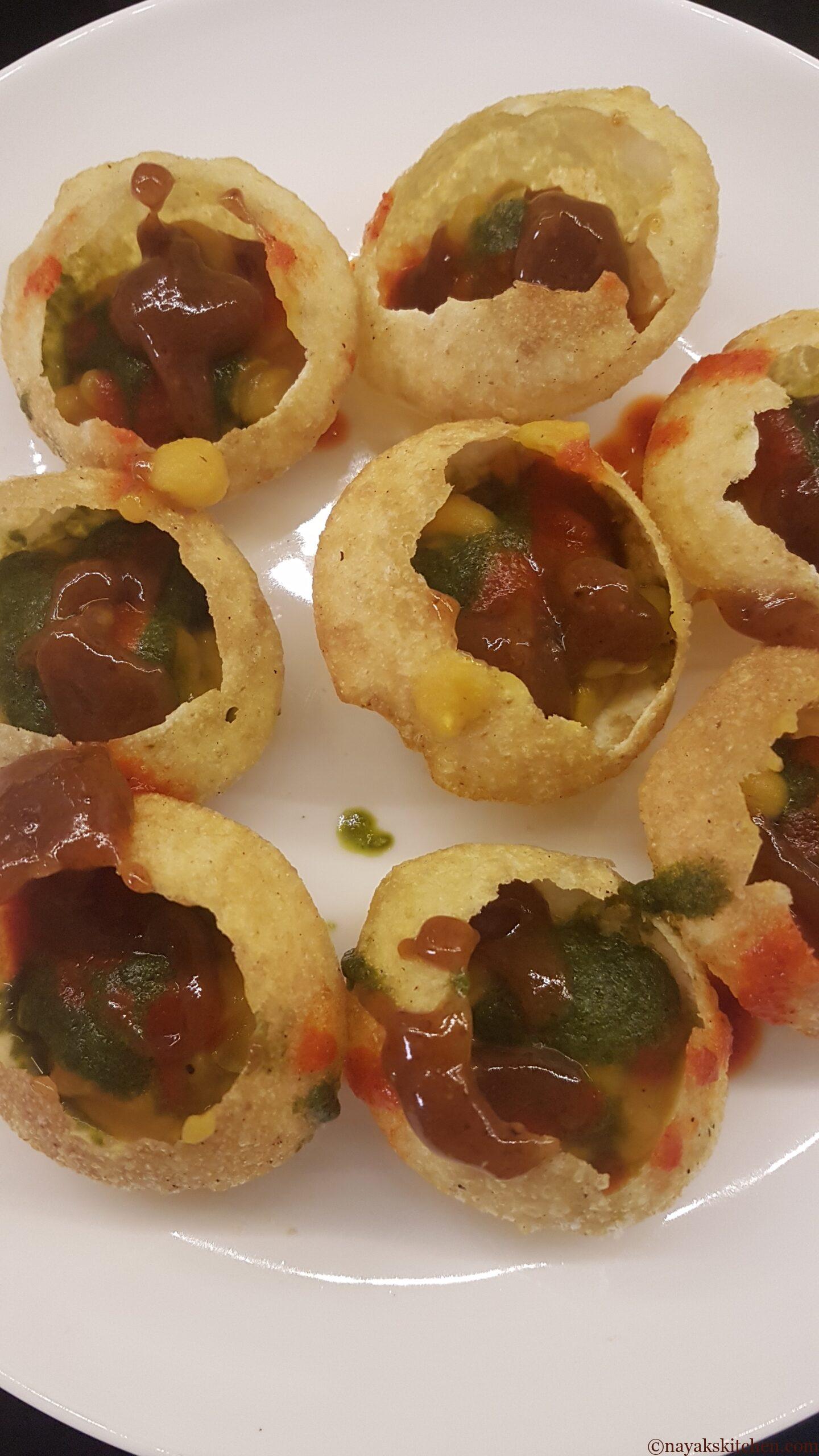 Adding tamarind chutney to puri