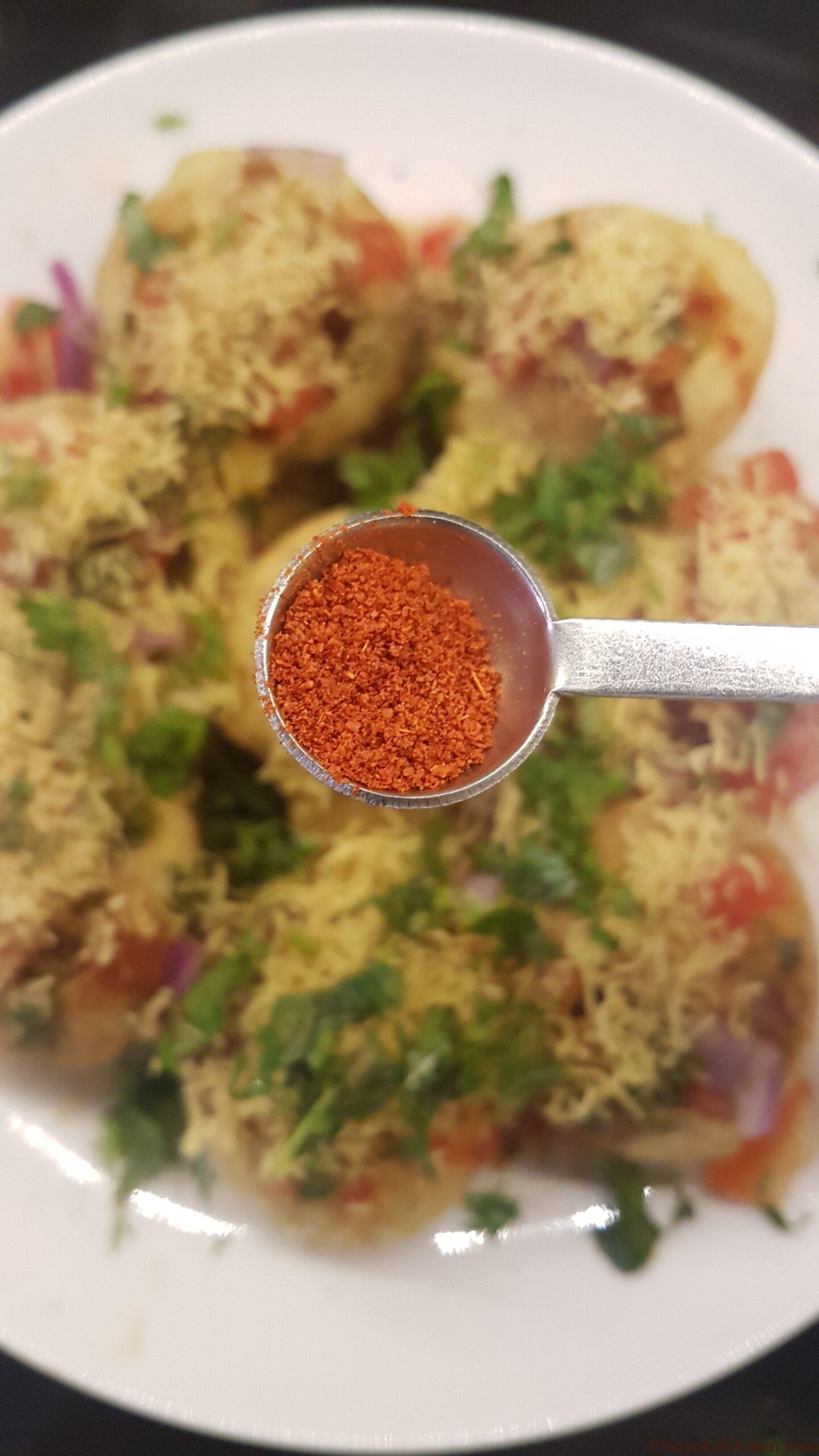 Sprinkling red chilli powder
