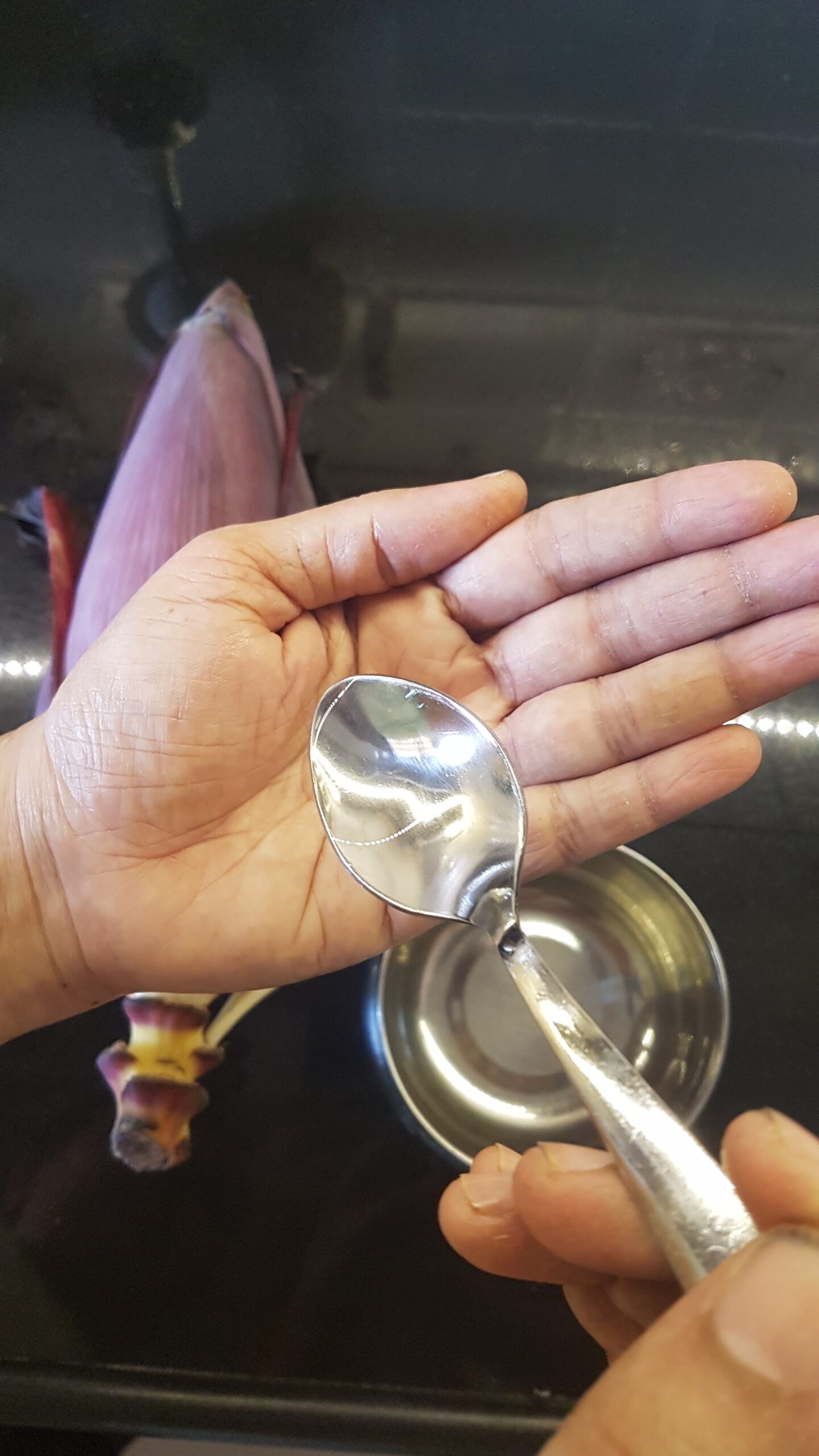 Applying coconut oil to hands