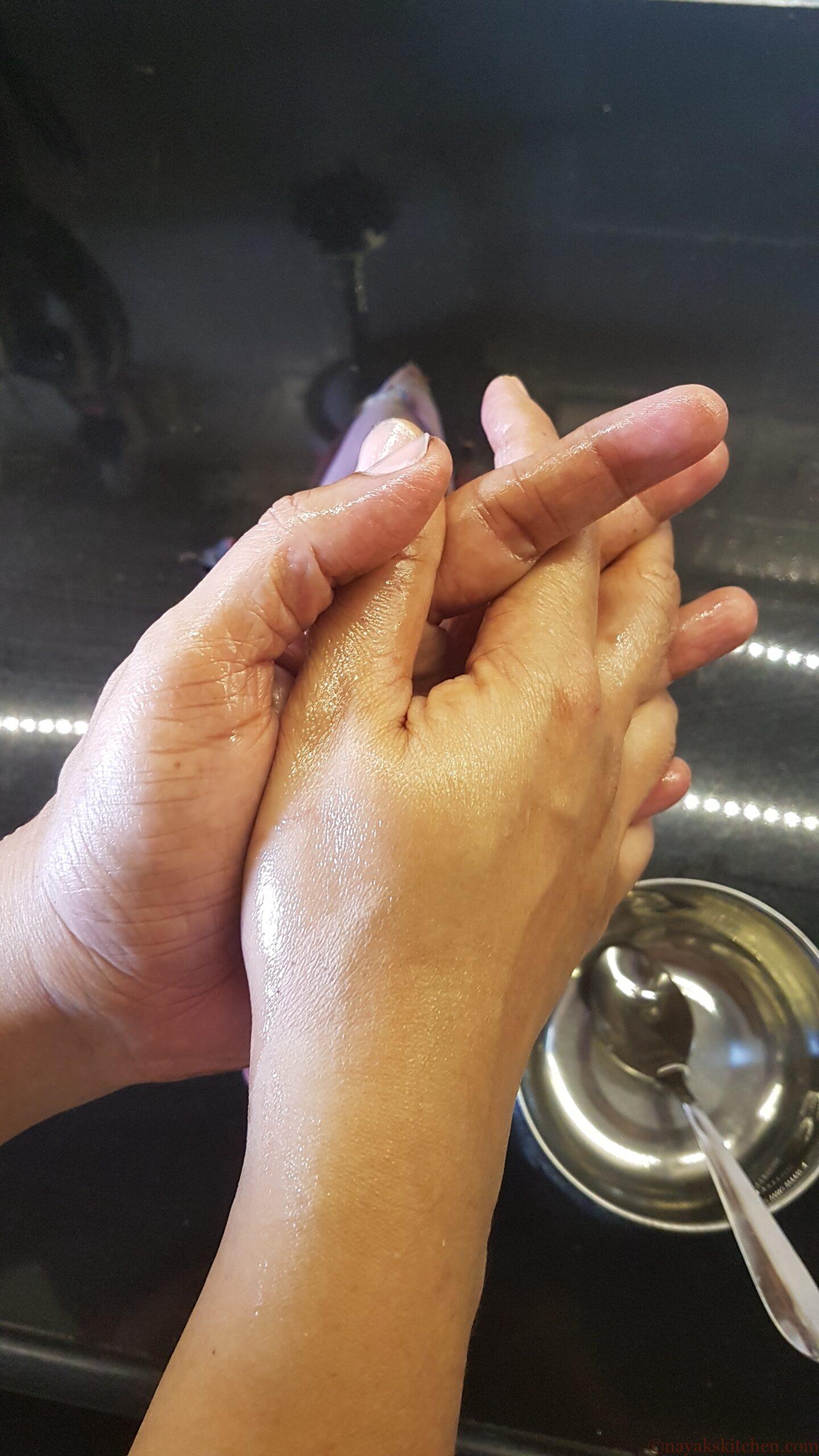 Rubbing hands well with coconut oil