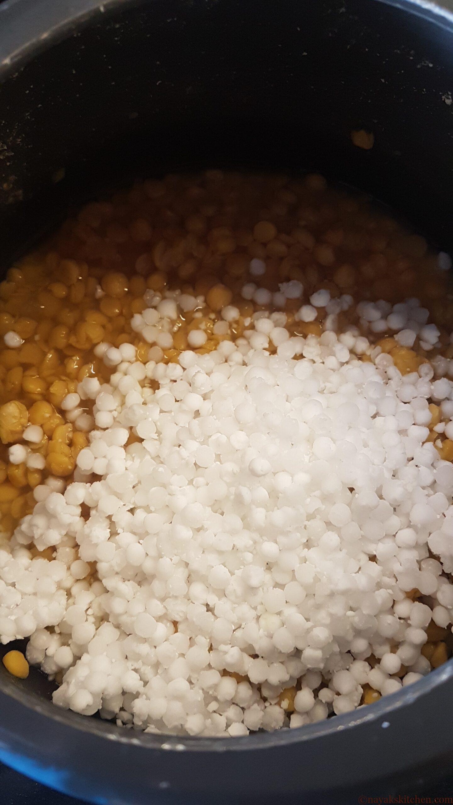 Adding sabudana to cooked chana dal