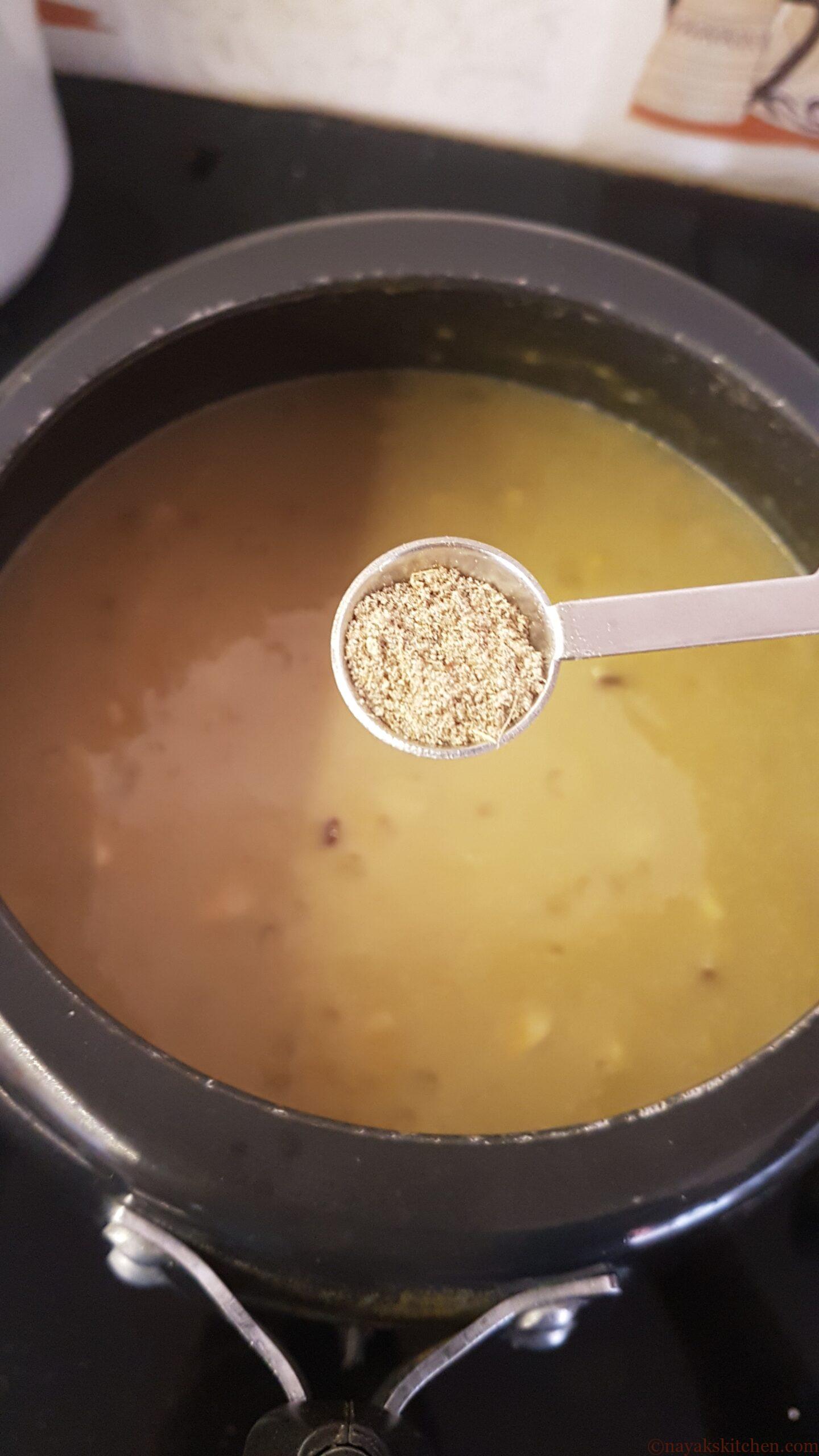 Adding cardamom powder