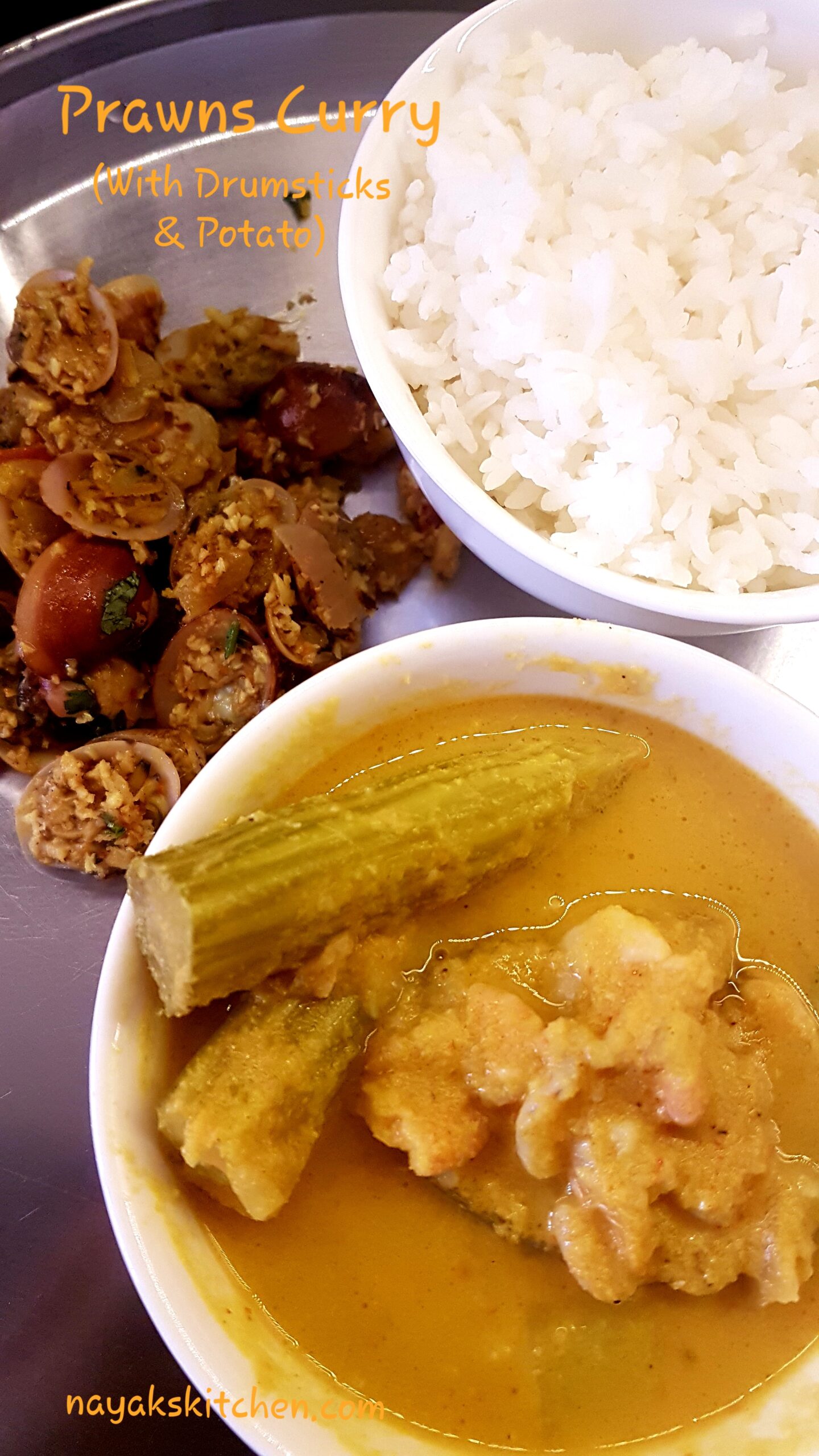 Prawns curry served with rice and tisryache sukhe