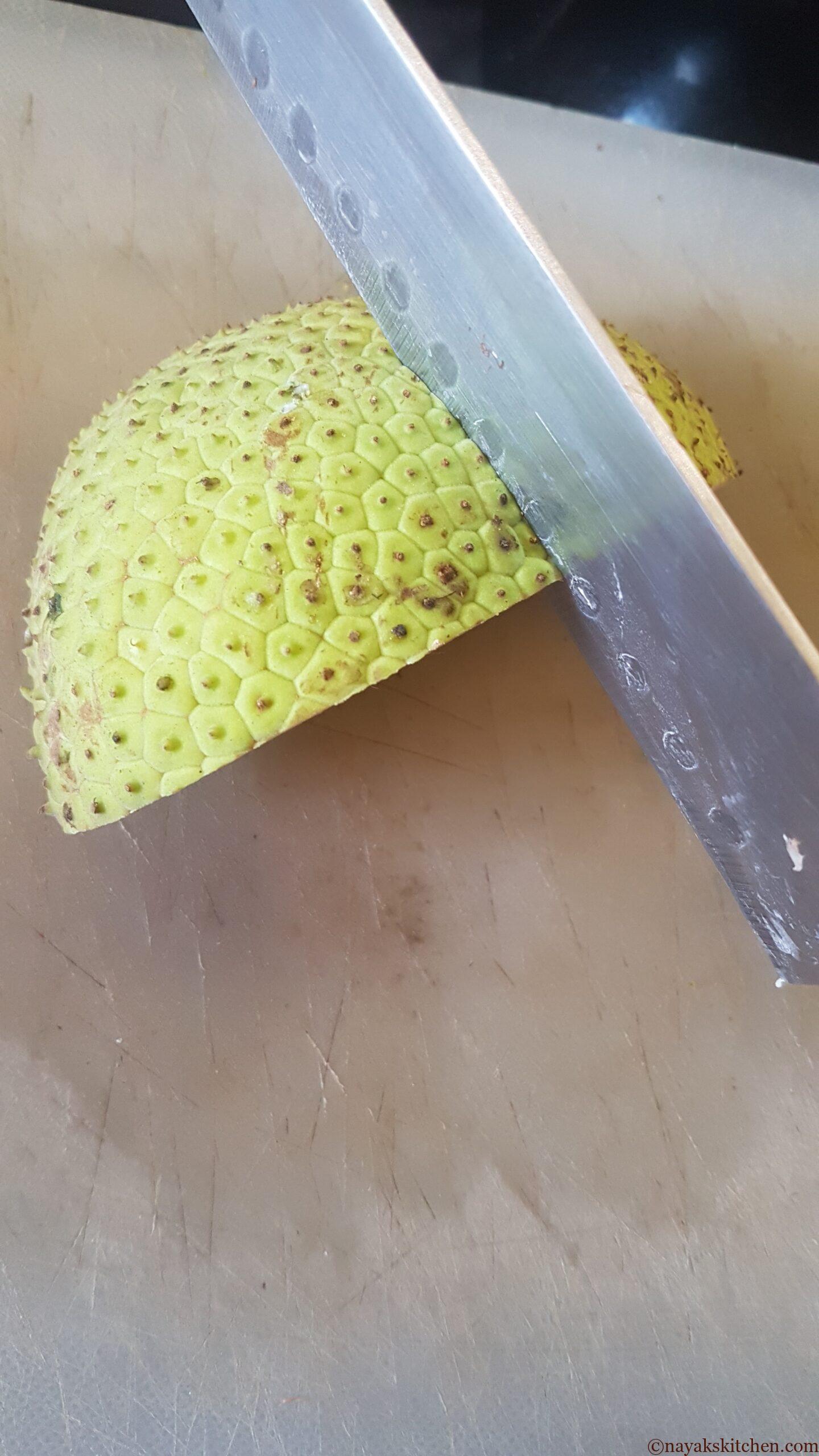 Cut the quarter of breadfruit into half