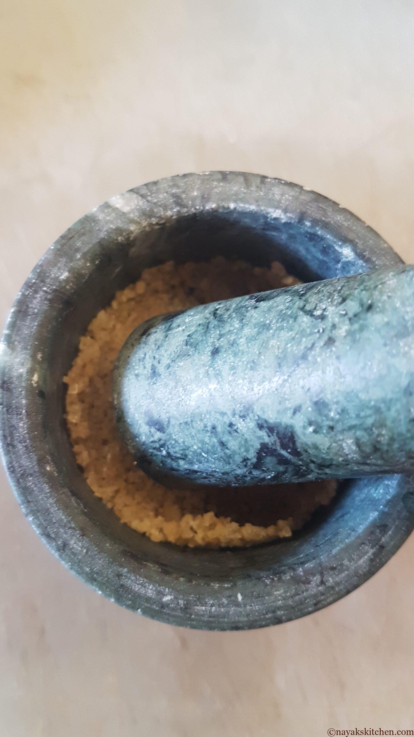 Crushing salt in a mortar pestle