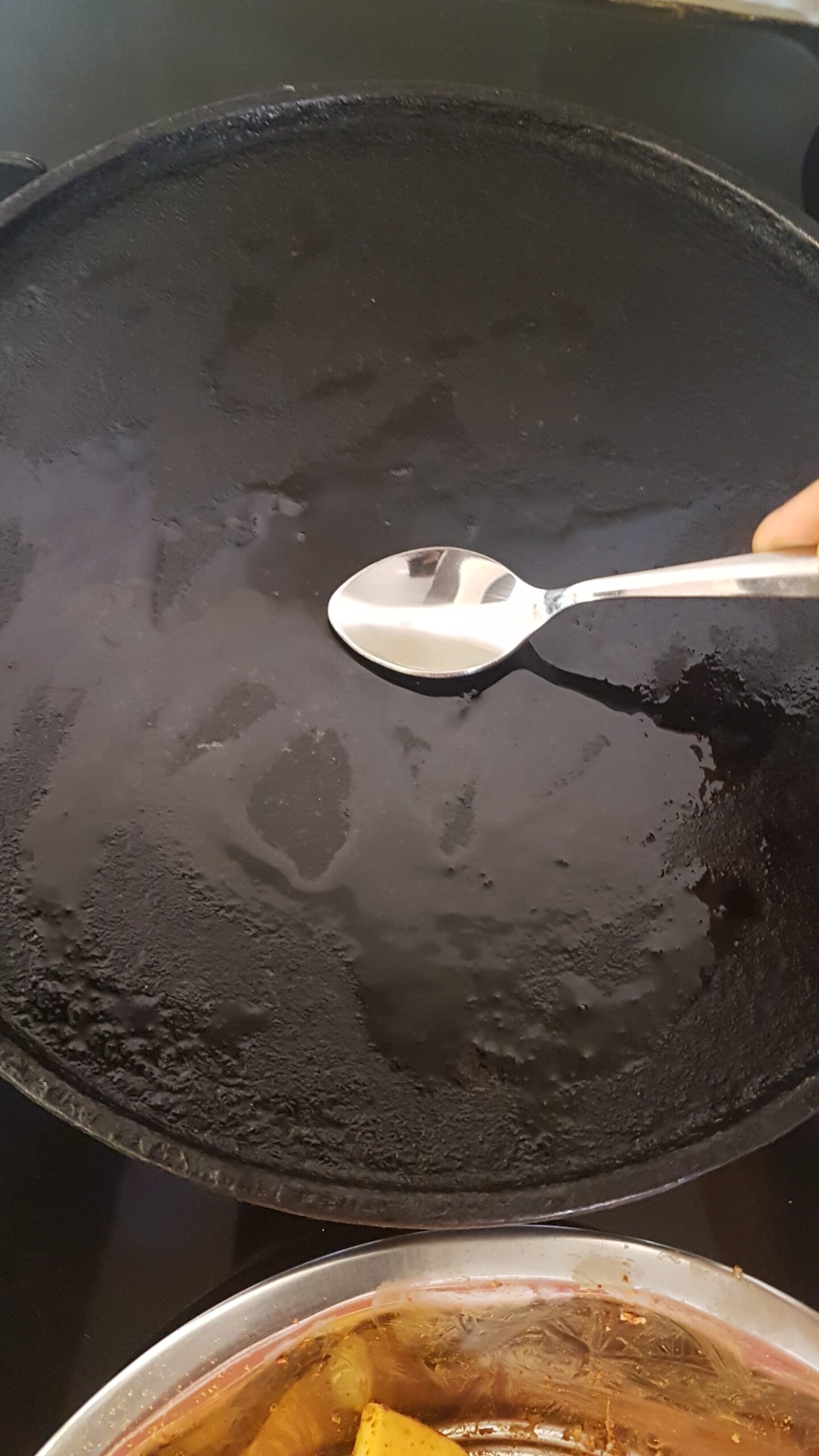 Smearing oil on a cast iron griddle