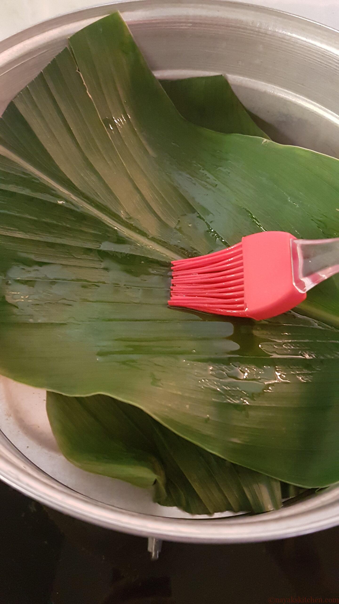 Brushing the leaf with oil