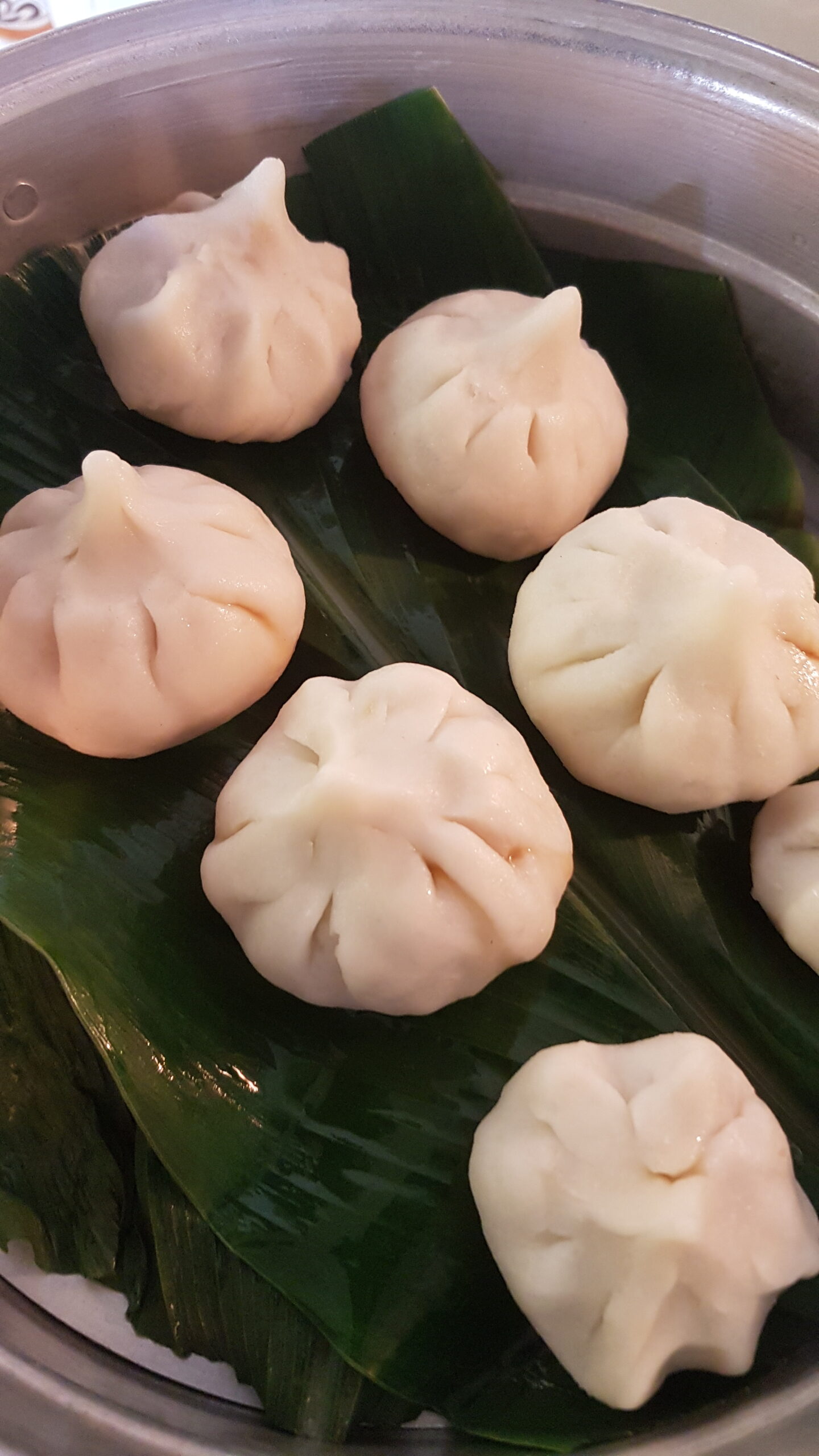 Placing the ukdiche modak in the steamer