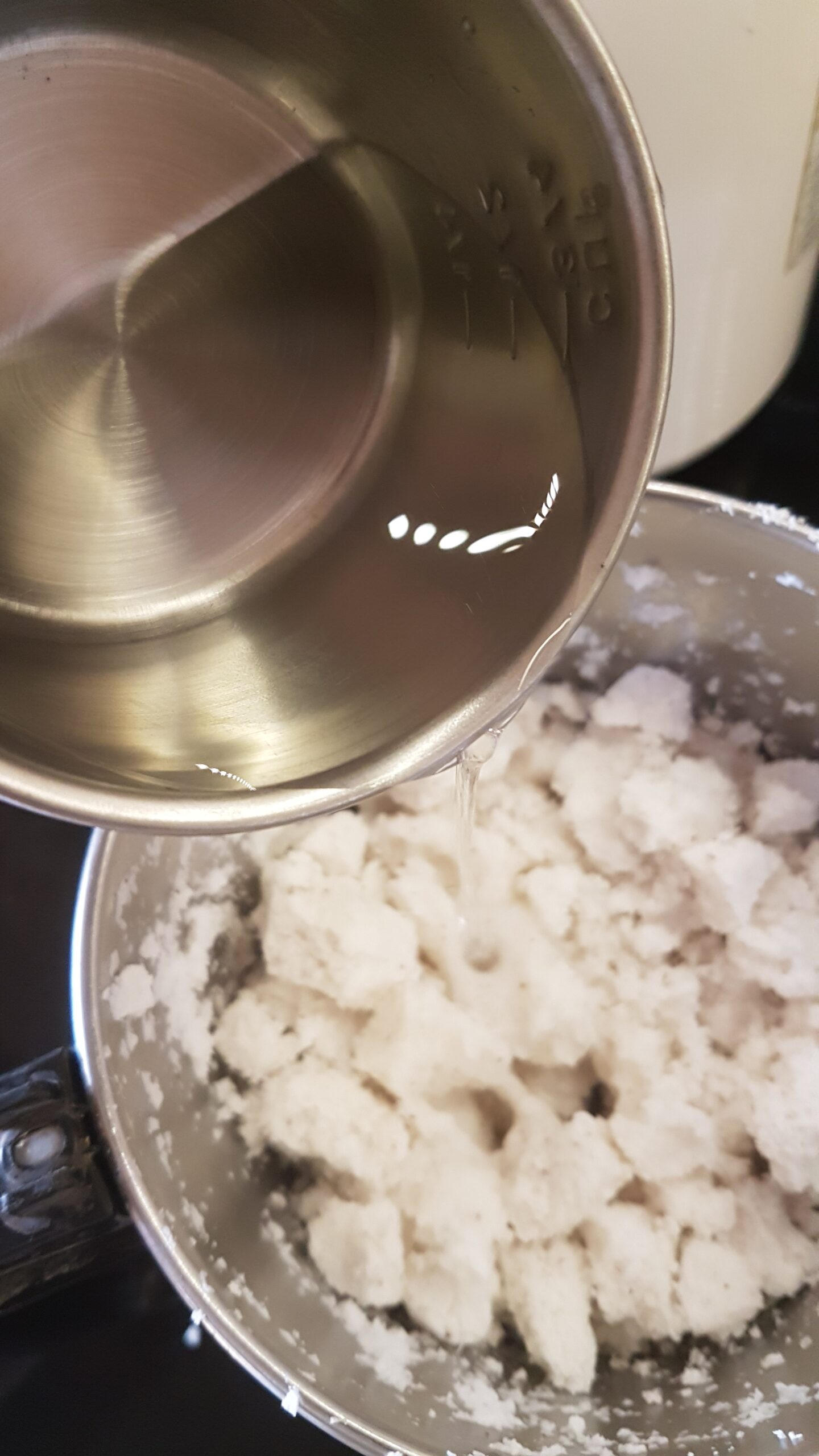 Adding water to coconut residue