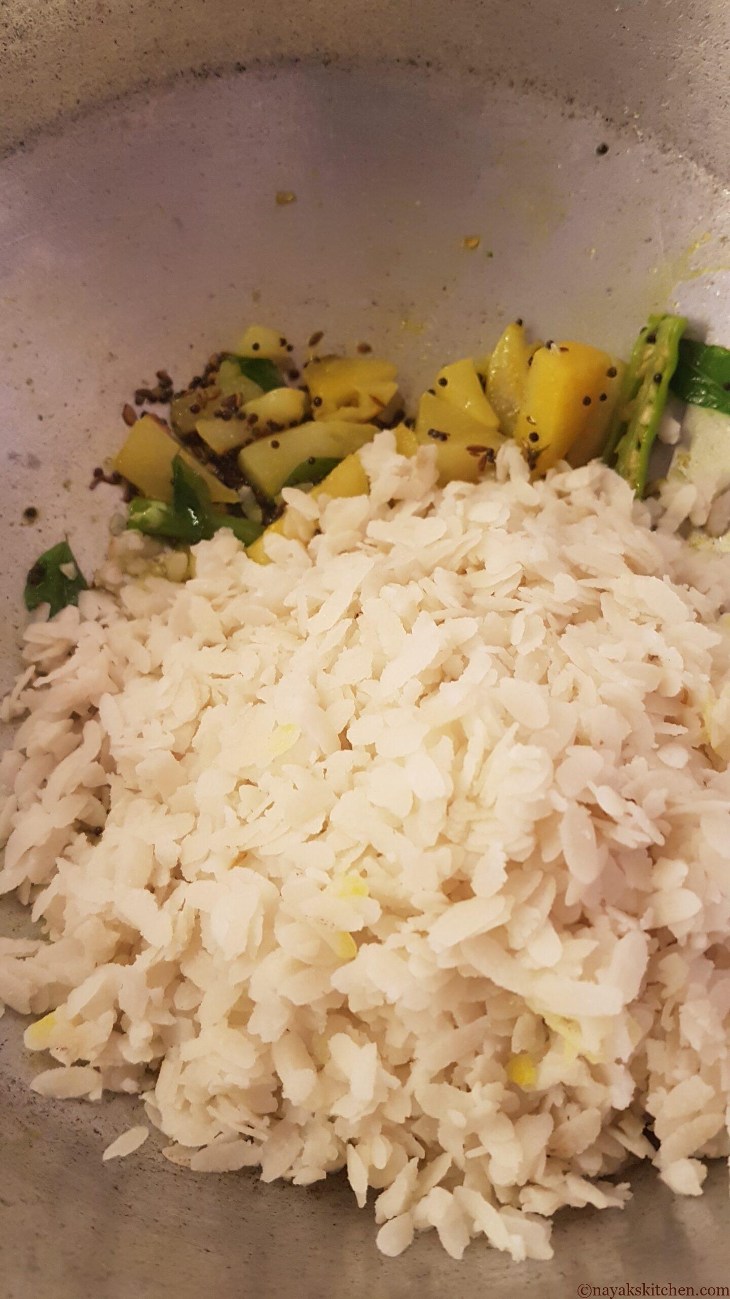 Adding washed poha