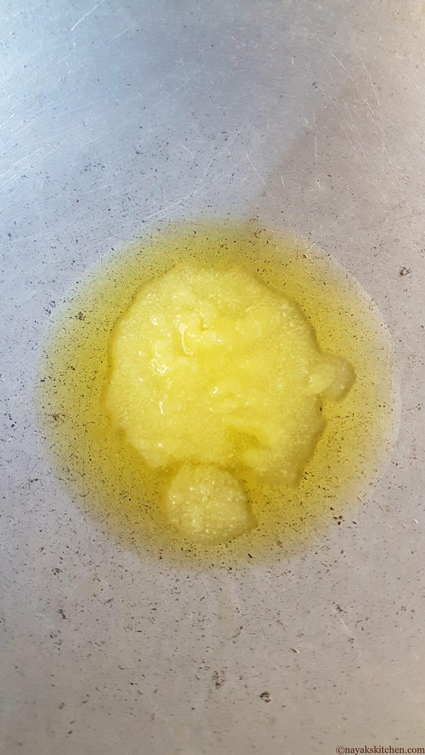 Heating ghee in a kadhai