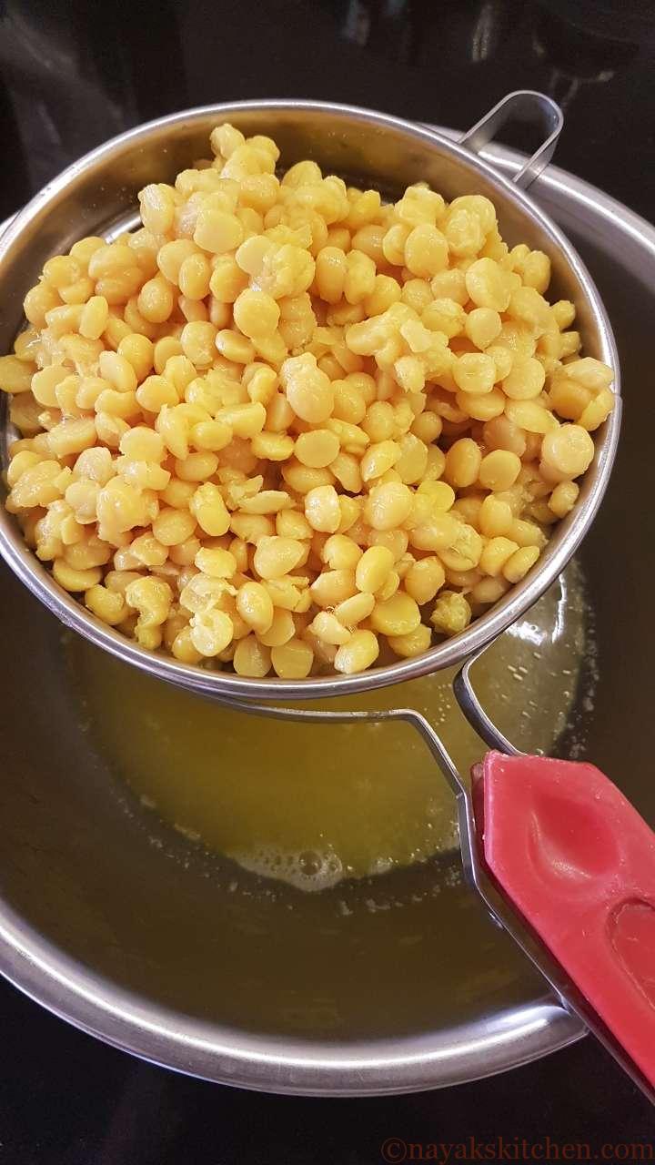 Straining cooked chana dal