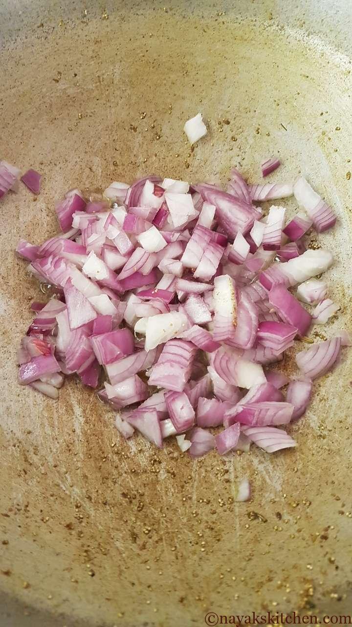 Adding onion in kadhai
