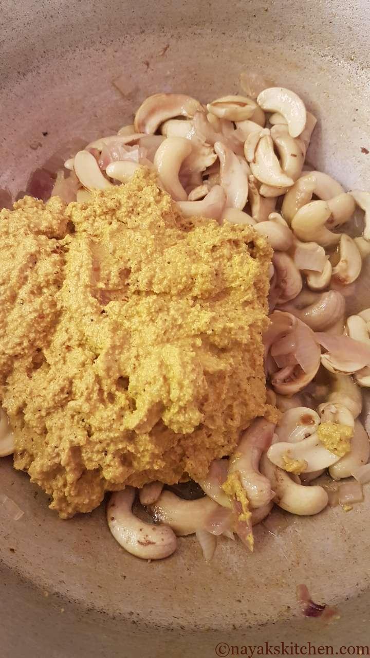 Adding ground paste to cashew nuts