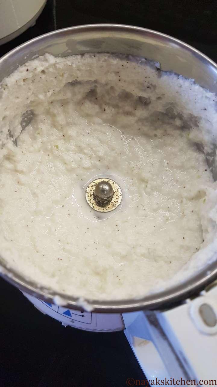 Grinding coconut and other ingredients to a paste