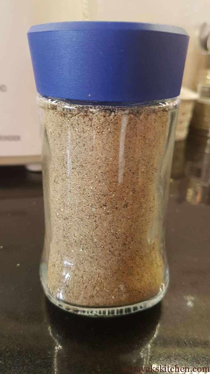 Elaichi powder stored in a glass bottle