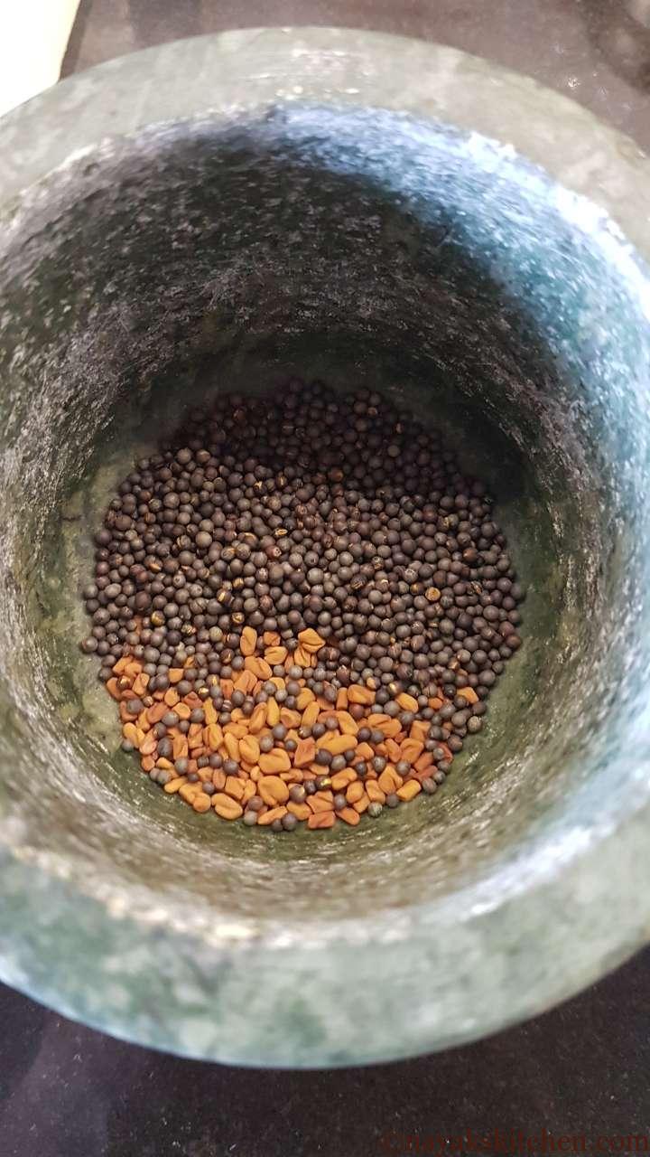 Mustard and fenugreek in a mortar-pestle