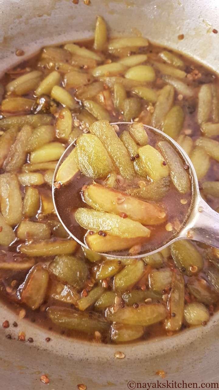 Cooked bilimbi in jaggery syrup