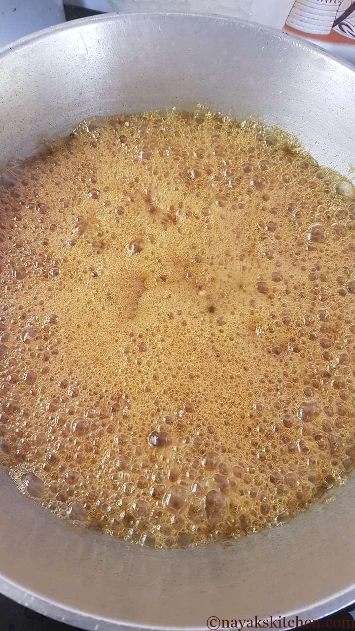 Boiling the jaggery to get a thick syrup