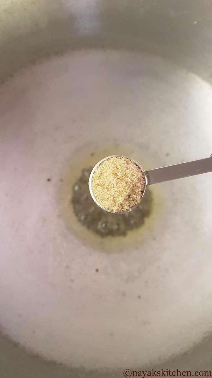 Adding asafoetida (hing)