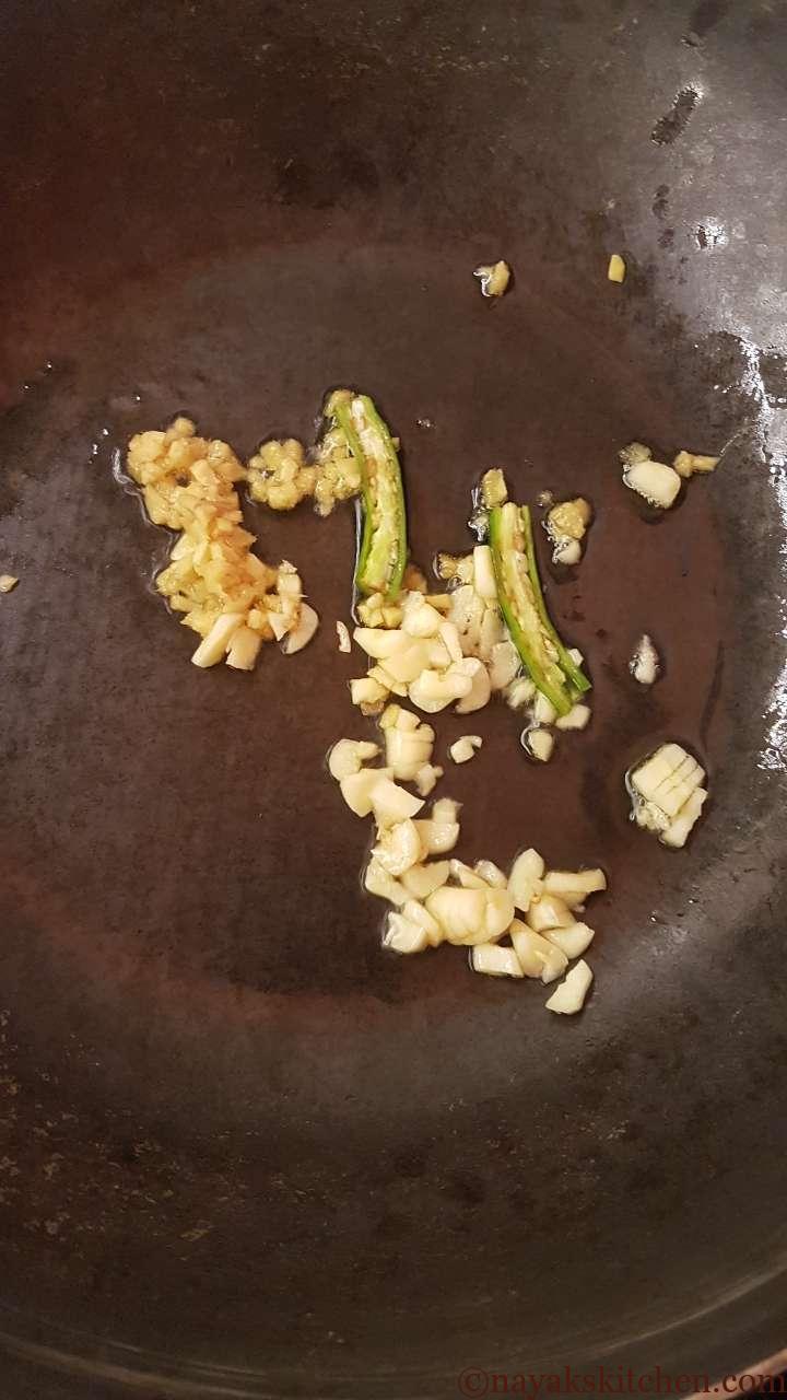Adding ginger, garlic and green chillies
