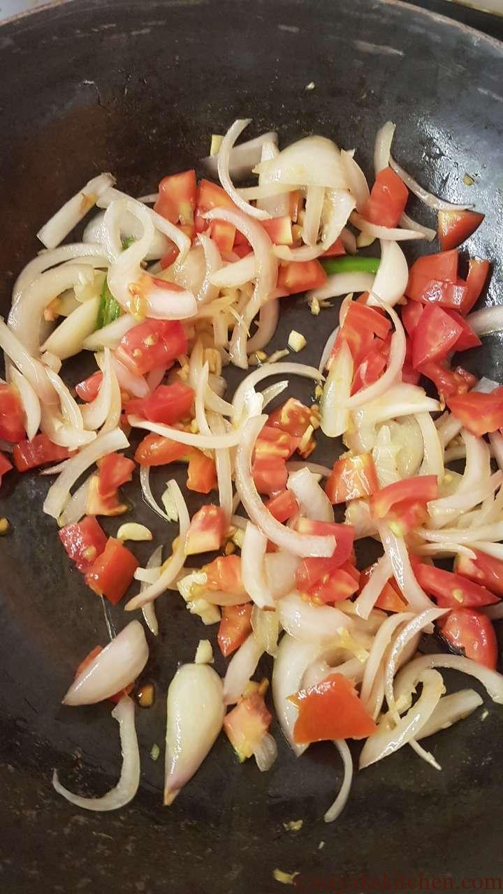 Adding chopped tomatoes