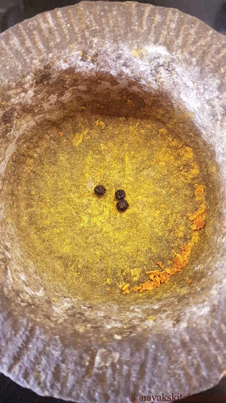 Black pepper in a mortar and pestle