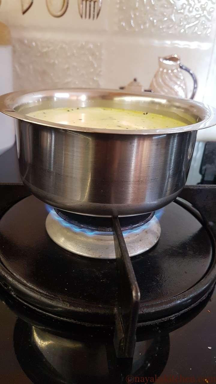 Boiling turmeric and milk