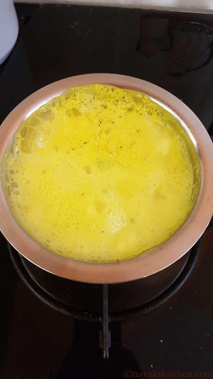 Boiling turmeric and milk