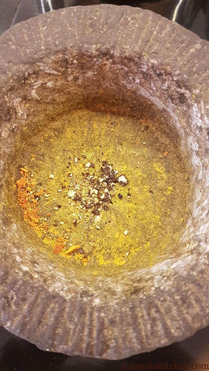 Crushed pepper in a mortar and pestle